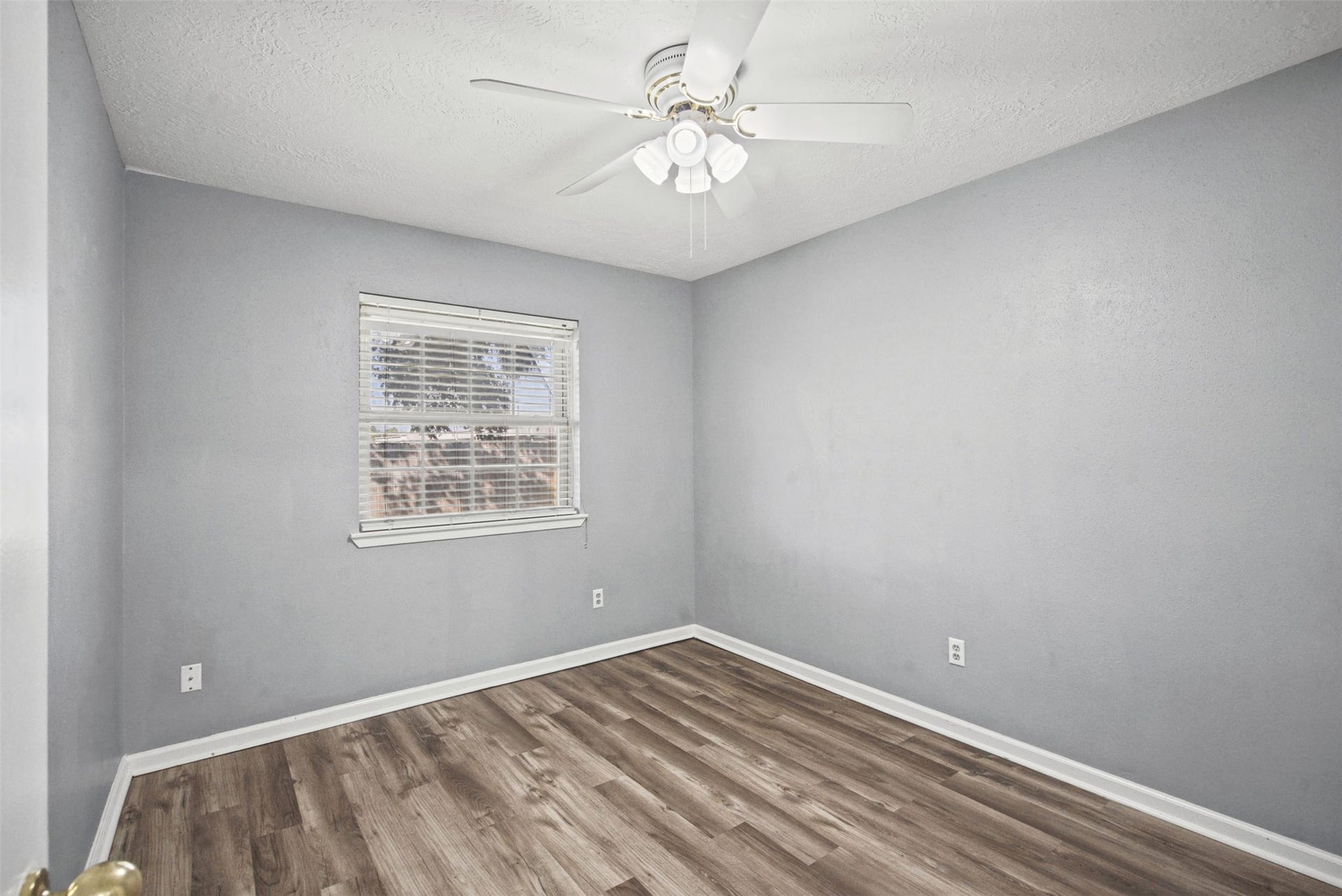 1323 Castle Glen Drive, Houston, TX 77015 Your space, your style! Neutral walls, attractive wood-look flooring, and natural light create a versatile bedroom ready to reflect your personal touch.