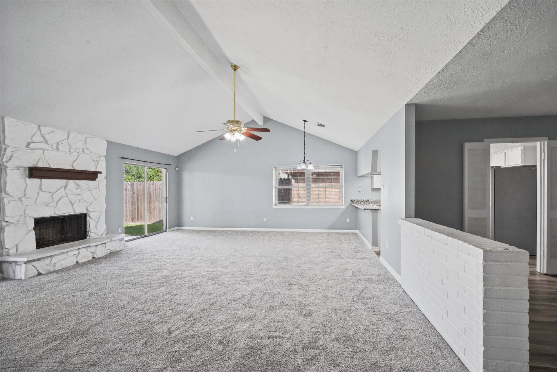 1323 Castle Glen Drive, Houston, TX 77015 Soaring vaulted ceilings, a striking stone fireplace, and an open layout set the stage for memorable gatherings and relaxing evenings at home.