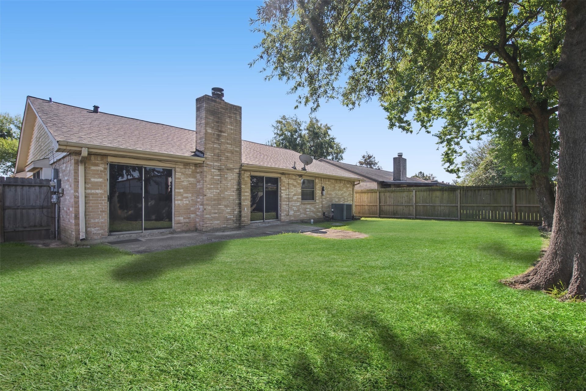 1323 Castle Glen Drive, Houston, TX 77015 The perfect place to unwind after a long day! Enjoy a beautiful stretch of green lawn, mature shade trees, and plenty of open space for making the most of sunny Texas days.