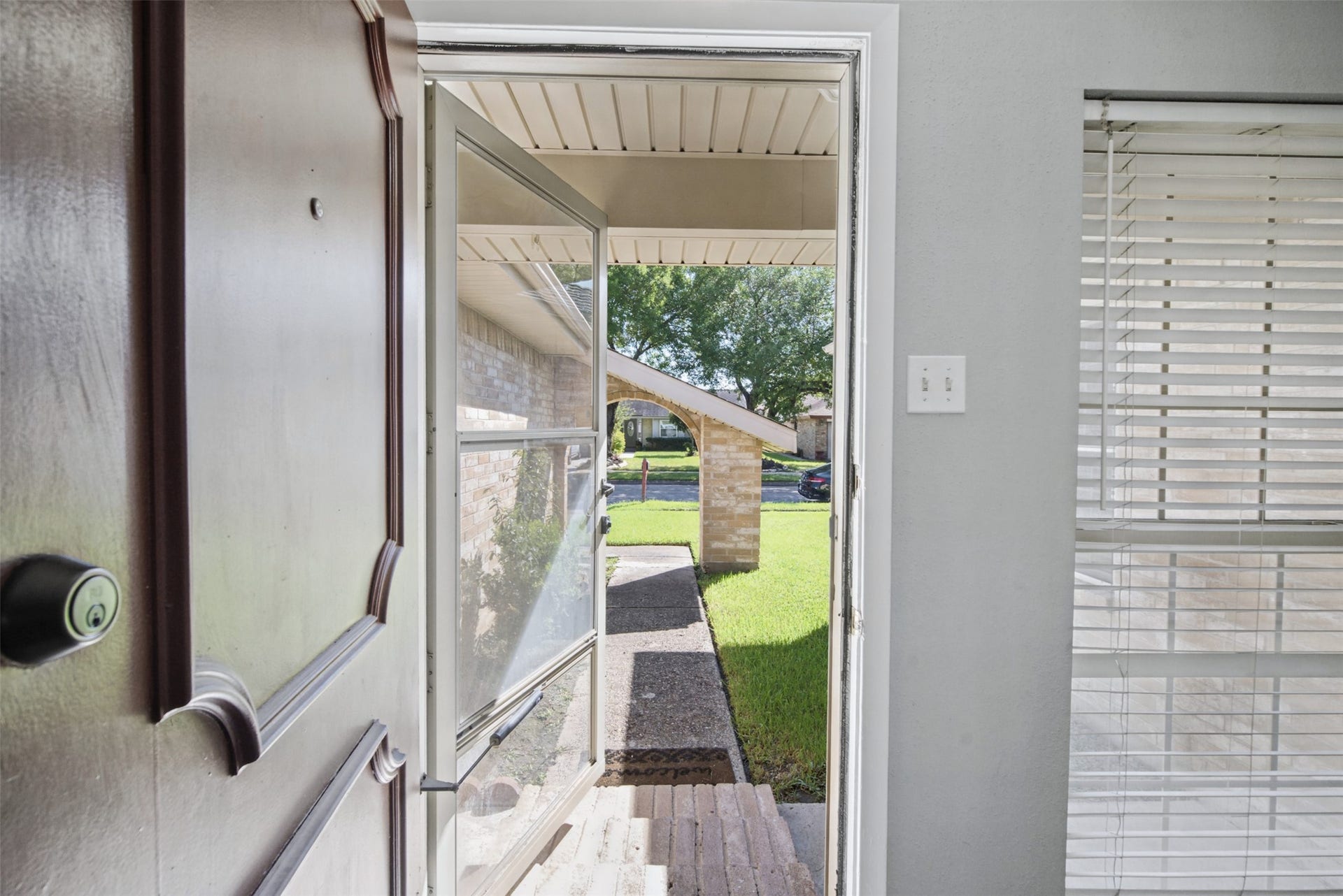 1323 Castle Glen Drive, Houston, TX 77015 Every great home starts with a welcoming entrance! Natural light, a covered front approach, and a convenient storm door make this entry both inviting and practical.