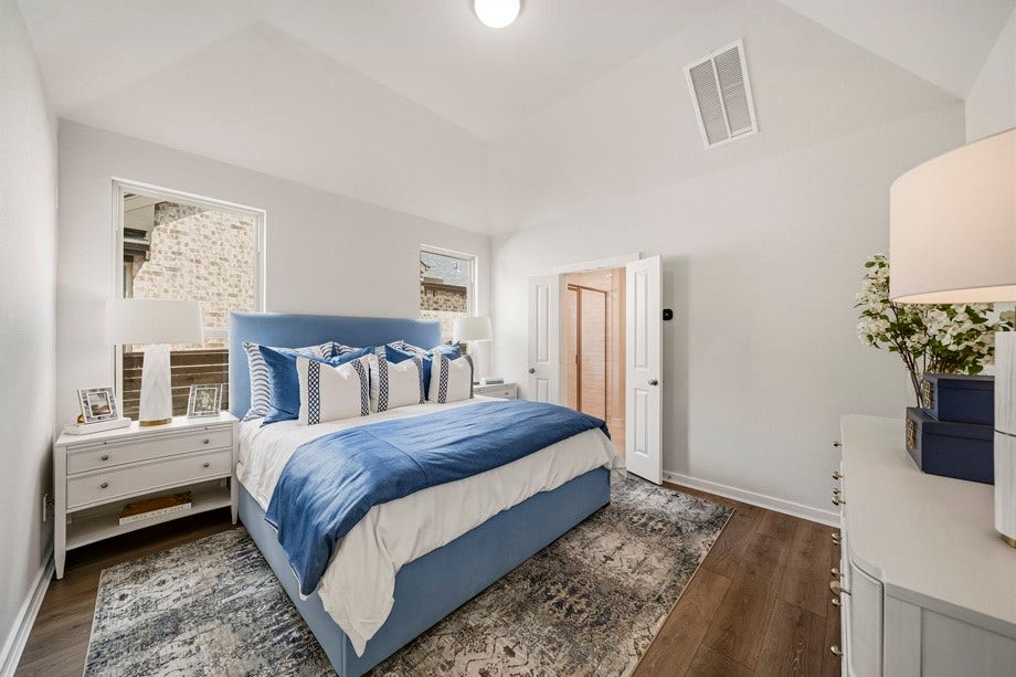 3334 Verdant Lane, Richmond, TX 77406 Primary bedroom showcases high ceilings and upgraded luxury vinyl plank flooring and tile in the large primary closet