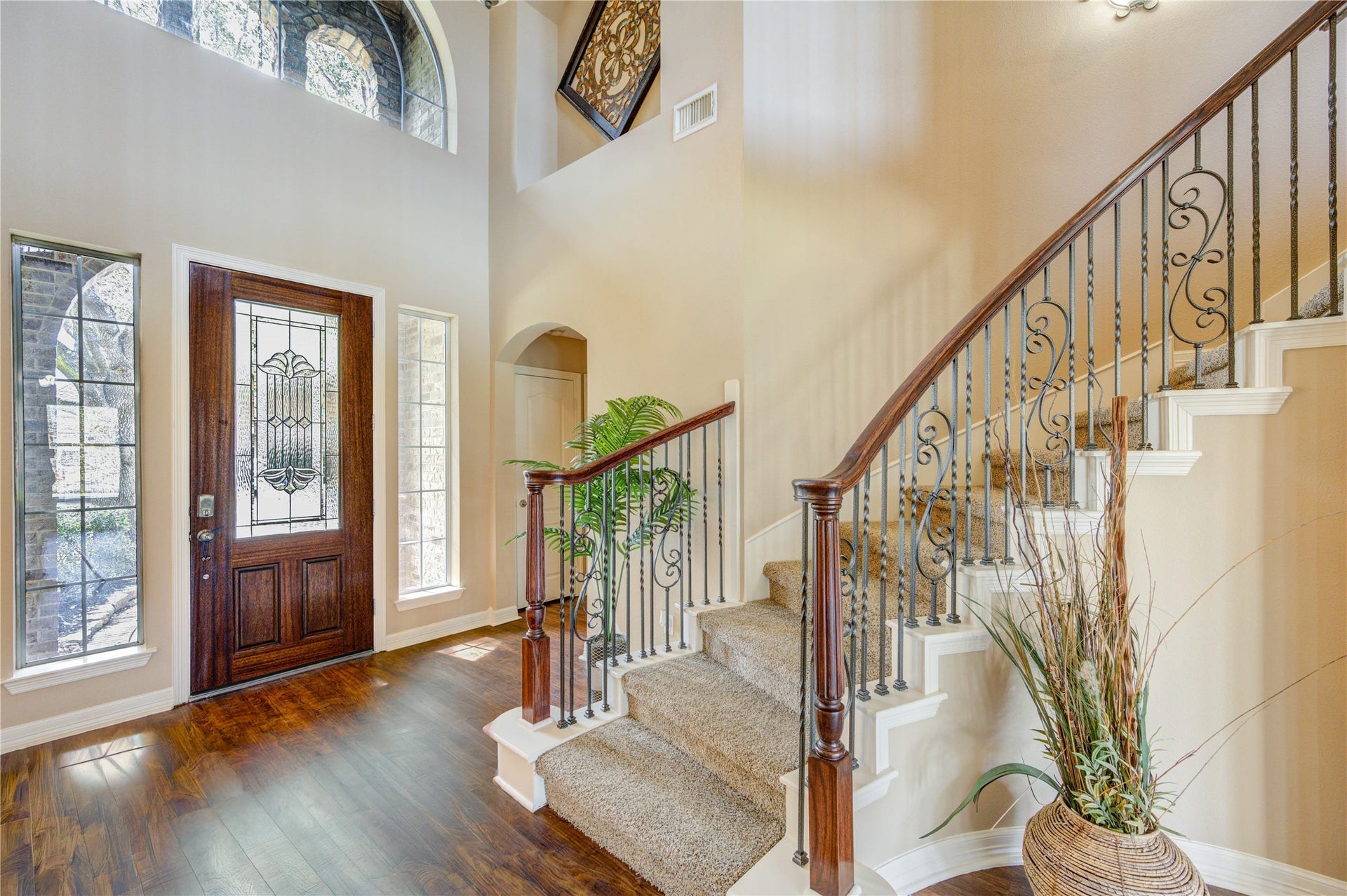 18614 Thomas Survey Drive, Cypress, TX 77433 Open living space with a beautiful staircase and front entry view.