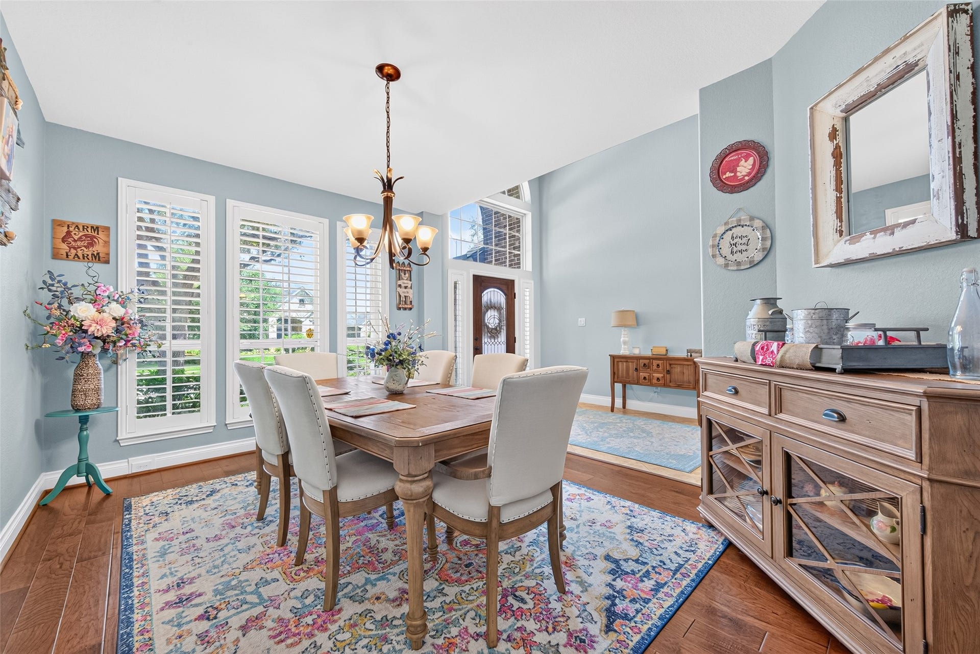 6710 Aqua Falls, Missouri City, TX 77459 Charming dining room with soft blue walls, and elegant chandelier.