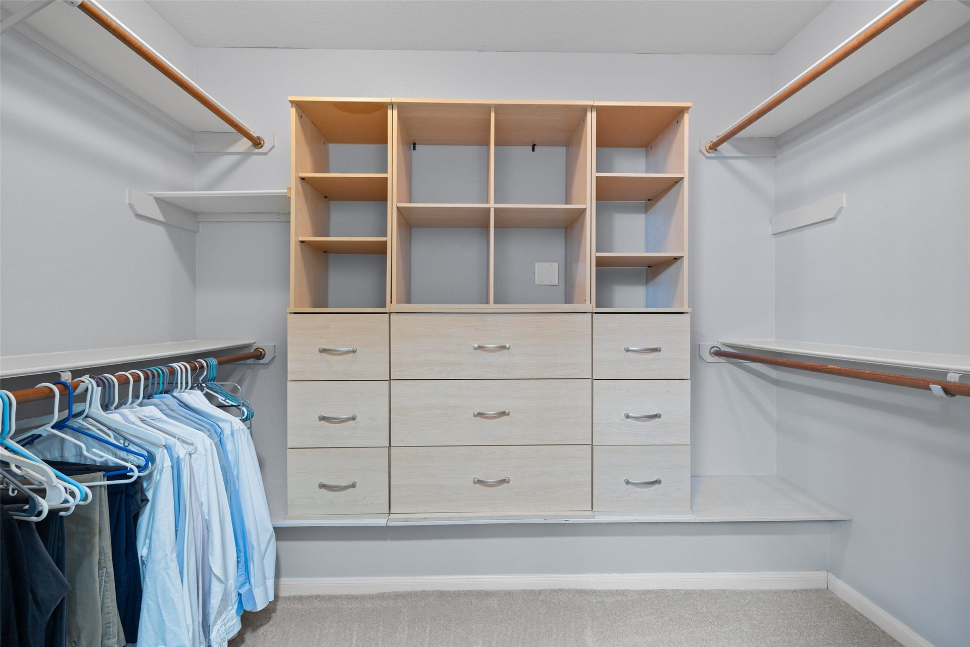 21 Long Hearth Place, The Woodlands, TX 77382 Walk-In Closet Built-in shelving provides additional organization.