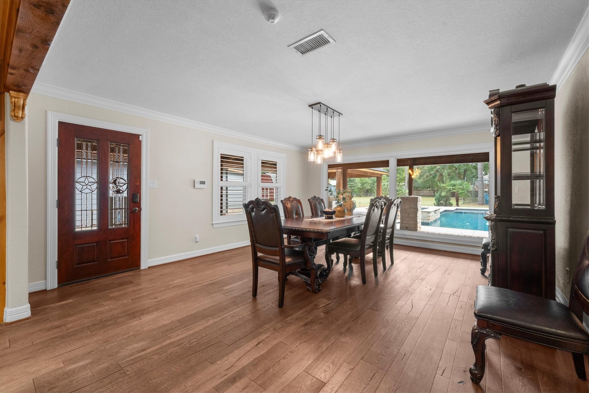 7119 Poole Road, Spring, TX 77379 The view of the pool from this window is magnificent. This dining area could also be used as another living area. Imagine some large leather sofas here as everyone gathers near the kitchen and roams in and out by the pool area.
