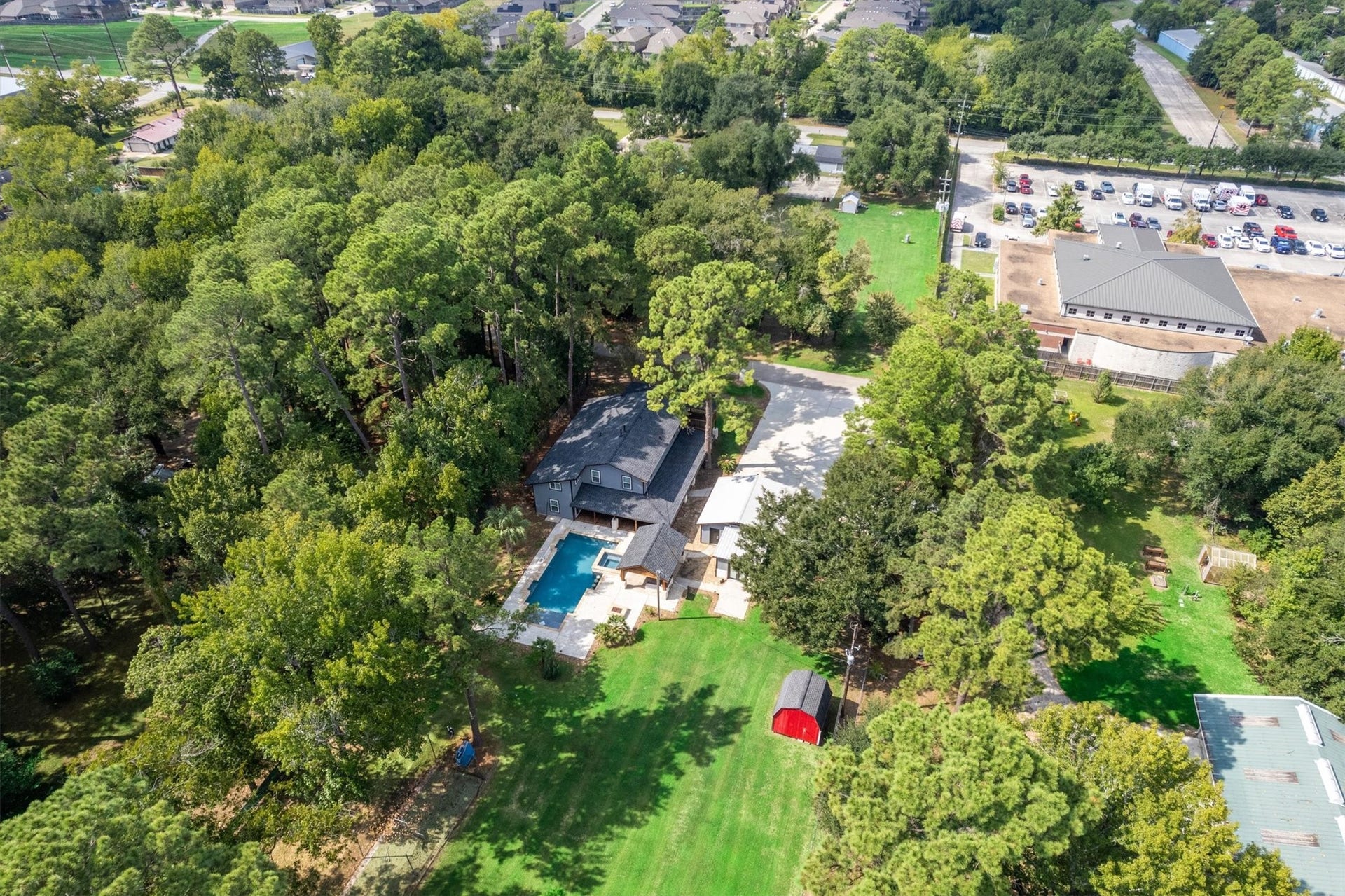 7119 Poole Road, Spring, TX 77379 An expansive yard brings together a pool, guest house, storage shed, and batting cage, offering space for recreation, entertaining, and everyday enjoyment. Theres plenty of room to make the most of outdoor living.