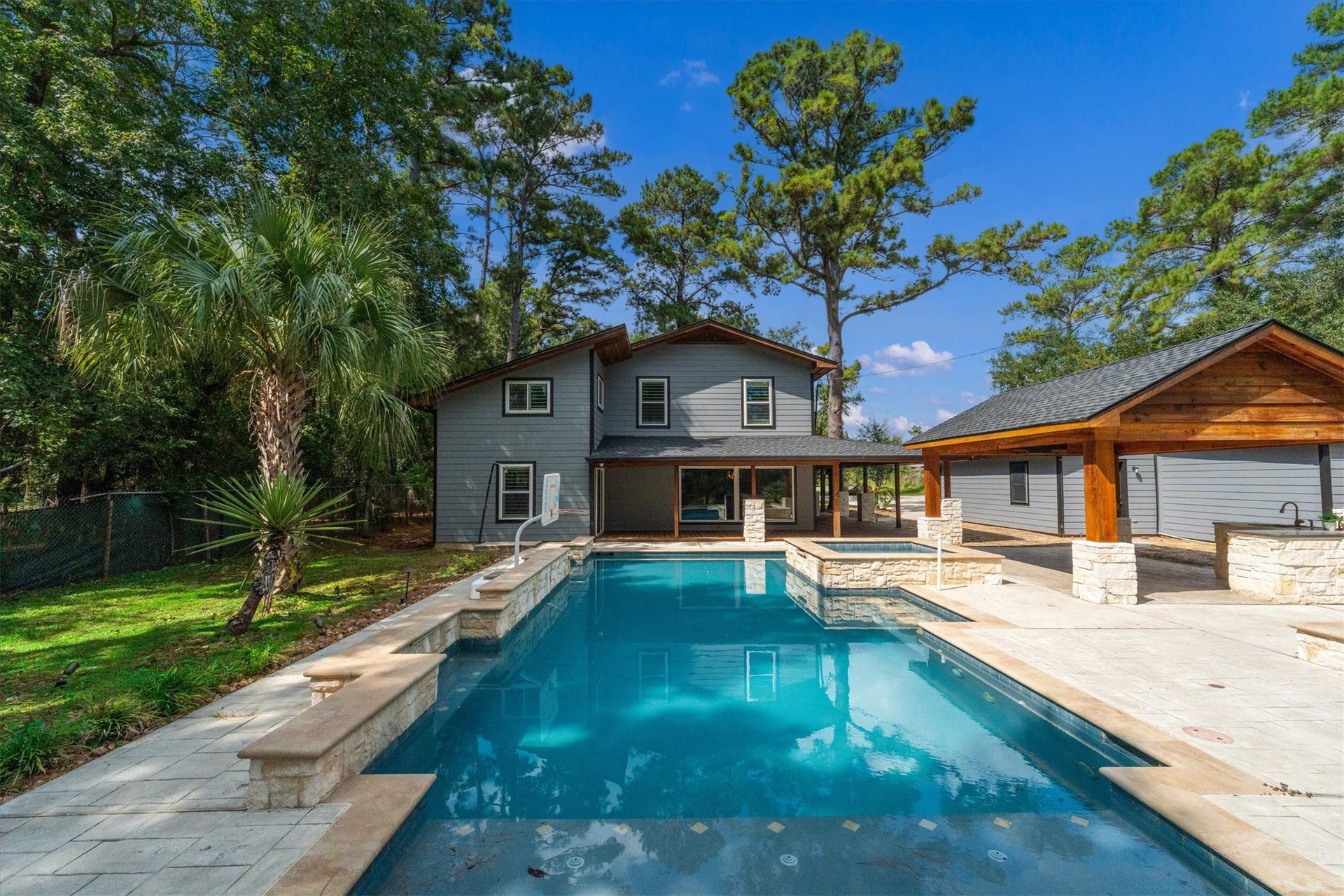 7119 Poole Road, Spring, TX 77379 The pool and hot tub create the ultimate outdoor entertaining spaceperfect for summer gatherings, refreshing swims, and relaxing evenings. Imagine this pool full of friends and family having a blast.
