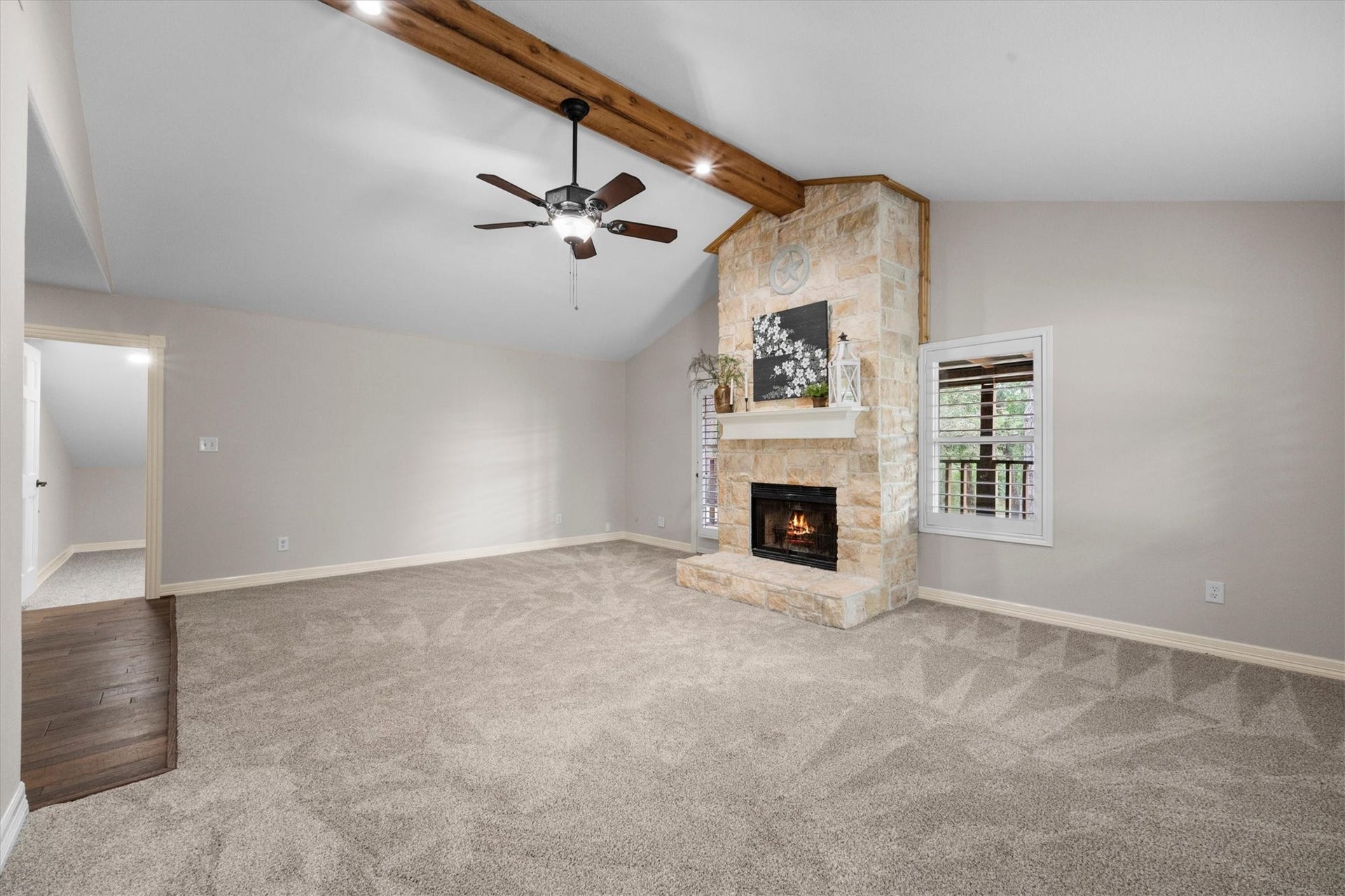 7119 Poole Road, Spring, TX 77379 The door beside the fireplace opens to the outdoor balcony making it an extension to the living space.