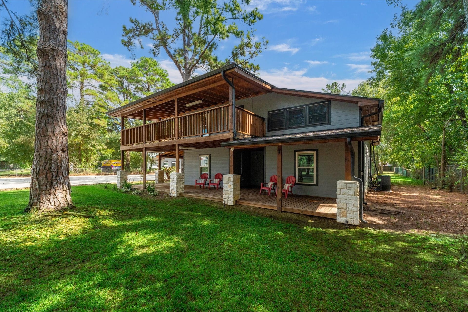 7119 Poole Road, Spring, TX 77379 A large balcony and wraparound porch create a welcoming first impression and inviting spaces to enjoy the outdoors. You truly enter another world once you drive up to Poole Road. The quiet stillness invites you to slow down, sip your morning coffee, and enjoy the wooded surroundings