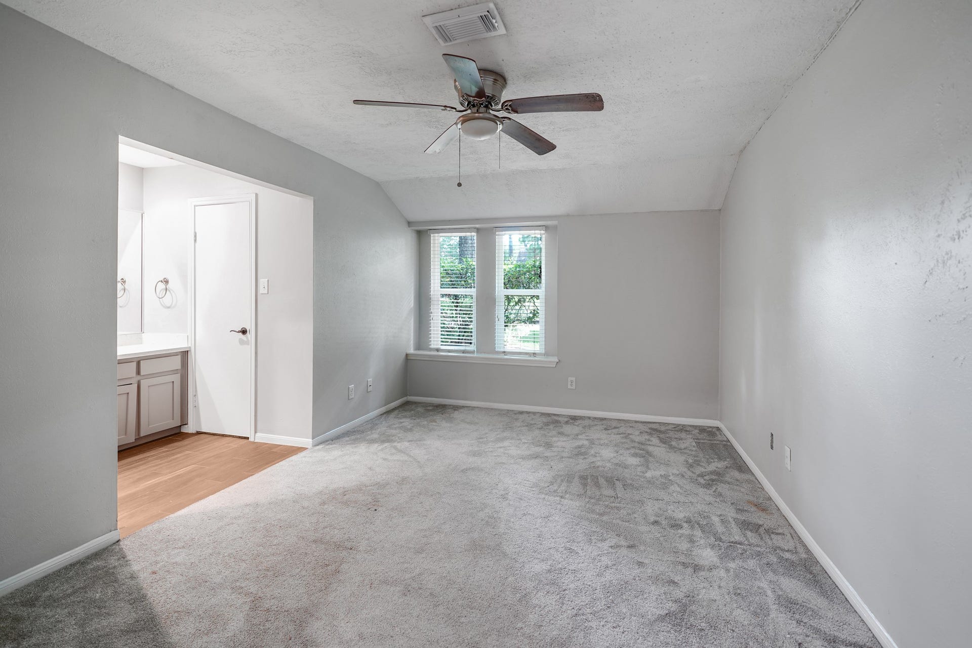2102 Oak Shores Drive, Houston, TX 77339 This is one of the two primary suites on the main level of this home.
