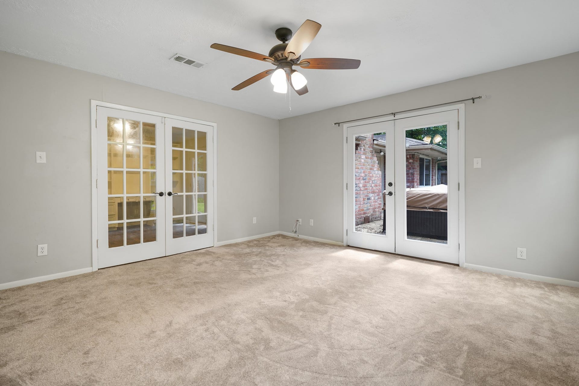 2102 Oak Shores Drive, Houston, TX 77339 Two sets of French Doors- one leads to the back yard, the other leads to the flex space in this primary suite.
