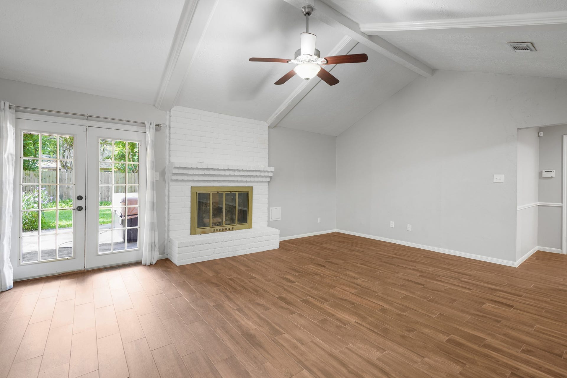2102 Oak Shores Drive, Houston, TX 77339 Inviting gas log fireplace and French doors opens to the backyard.