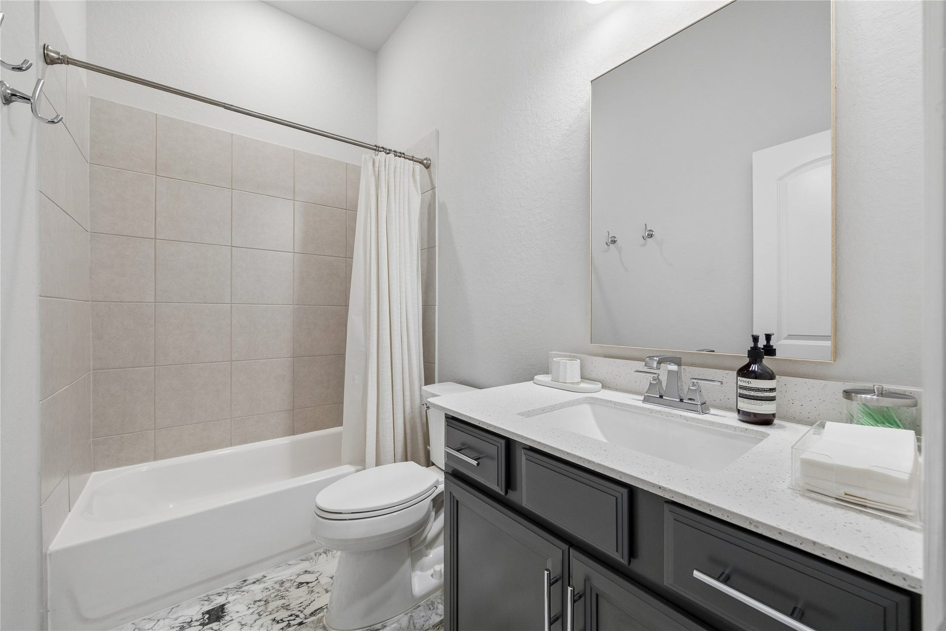 14231 Archer County Trail, Cypress, TX 77429 shared full bathroom near the 4th bedroom. updated marble floors and quartz countertops.