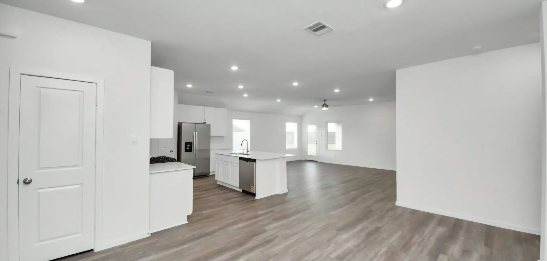 Spacious open-concept design connects the kitchen, dining, and living areas.