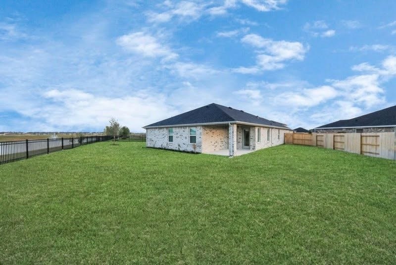 Spacious, fully fenced backyard with room to relax, play, or entertain.