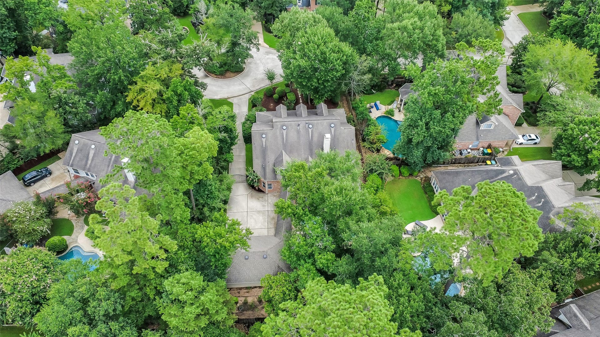 7 Larkspur Trail, The Woodlands, TX 77382 Nestled in lush greenery, this spacious home features a large driveway and offers a serene, private setting. Enjoy the tranquility of a neighborhood surrounded by mature trees and the convenience of nearby amenities.