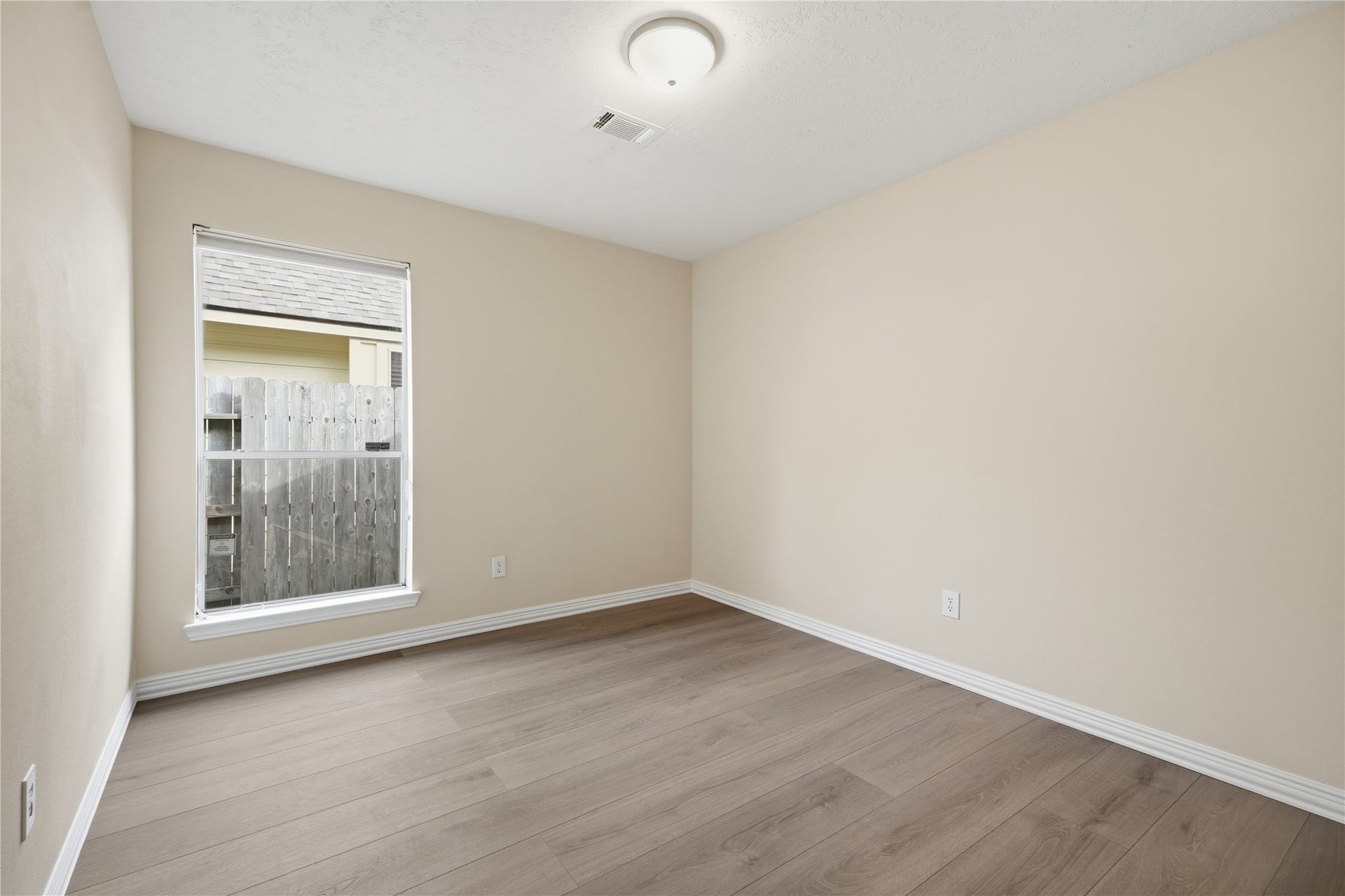 1411 Pebble Banks Lane, Seabrook, TX 77586 One of the 2 secondary bedroom with the continuous vinyl plank flooring.