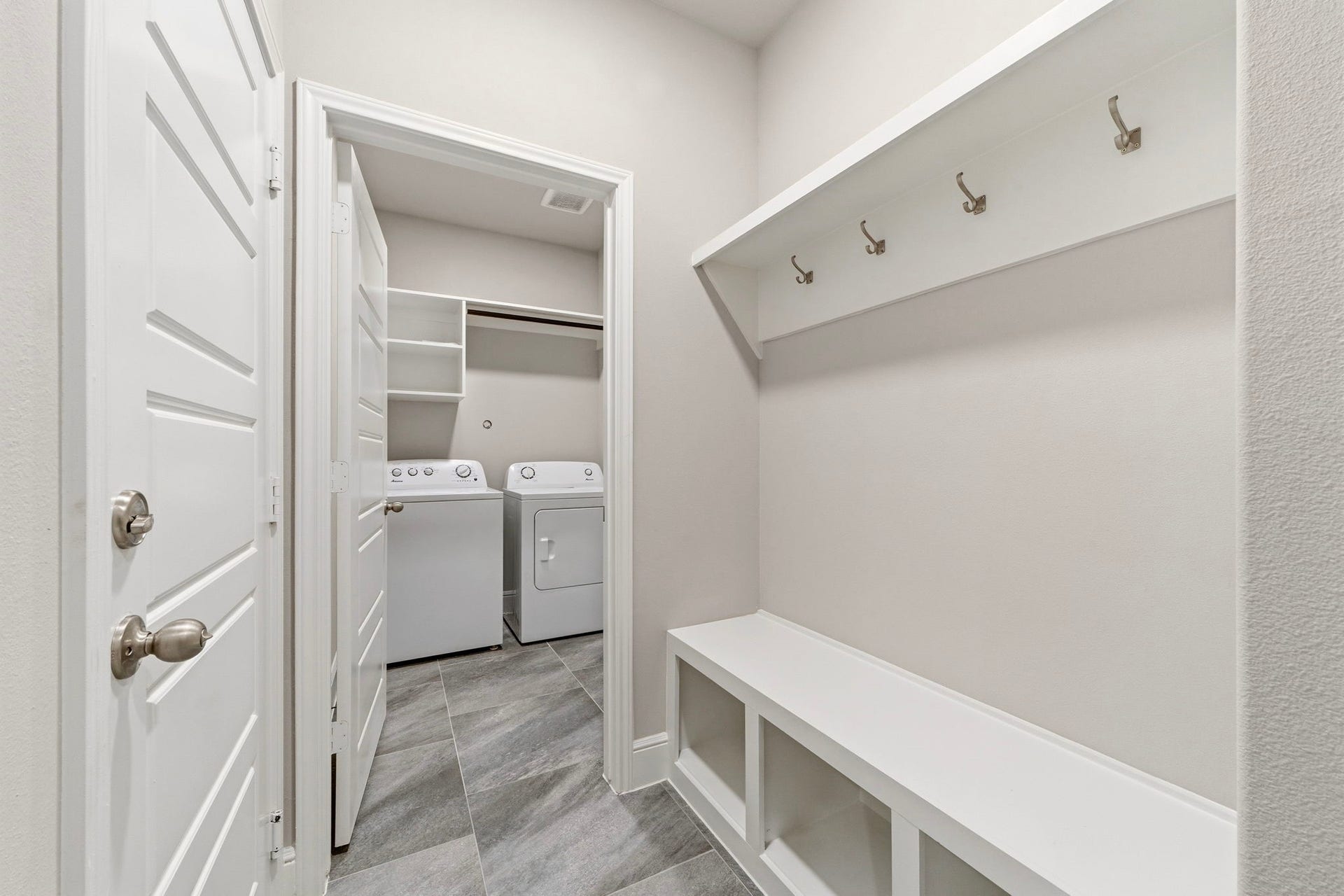 23620 Youpon Lane, Spring, TX 77389 Thoughtfully designed drop zone mudroom with built in bench, coat hooks, and bottom shelves