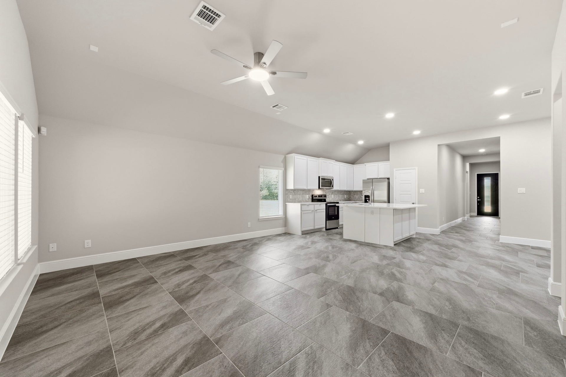 23620 Youpon Lane, Spring, TX 77389 Designed for gathering, this open concept living area offers style and functionality.