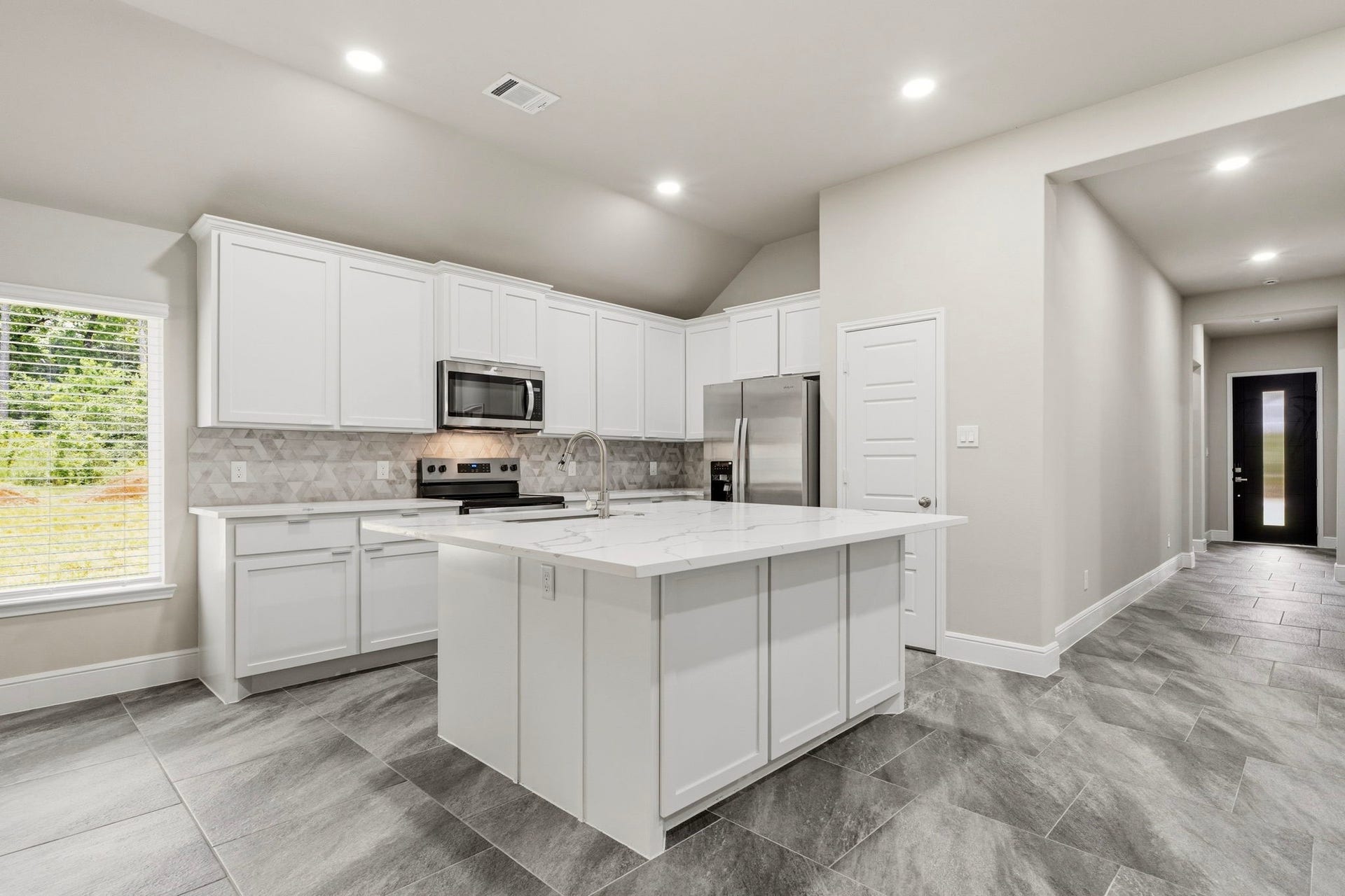 23620 Youpon Lane, Spring, TX 77389 Quartz Kitchen Island perfect for entertainment. Refrigerator stays.