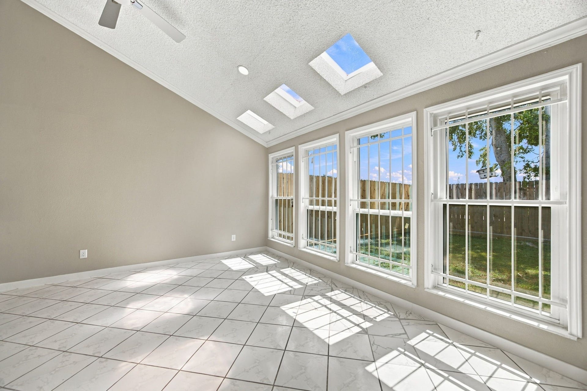 Tons of natural sunlight shines through into this beautiful dining space.