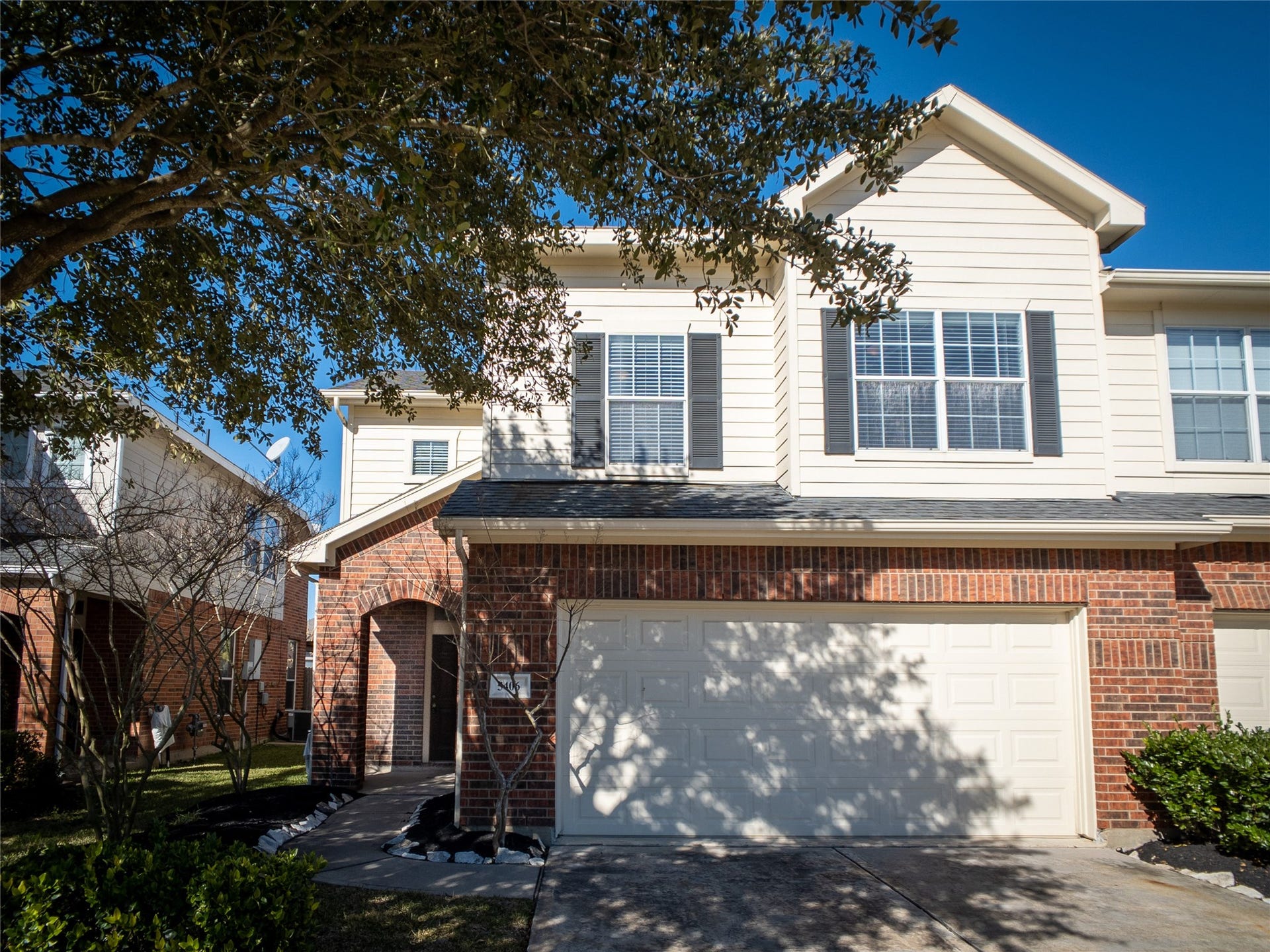 5406 Timber Court Hollow, Houston, TX 77084 2-story duplex townhome with nice, red brick & mature tree