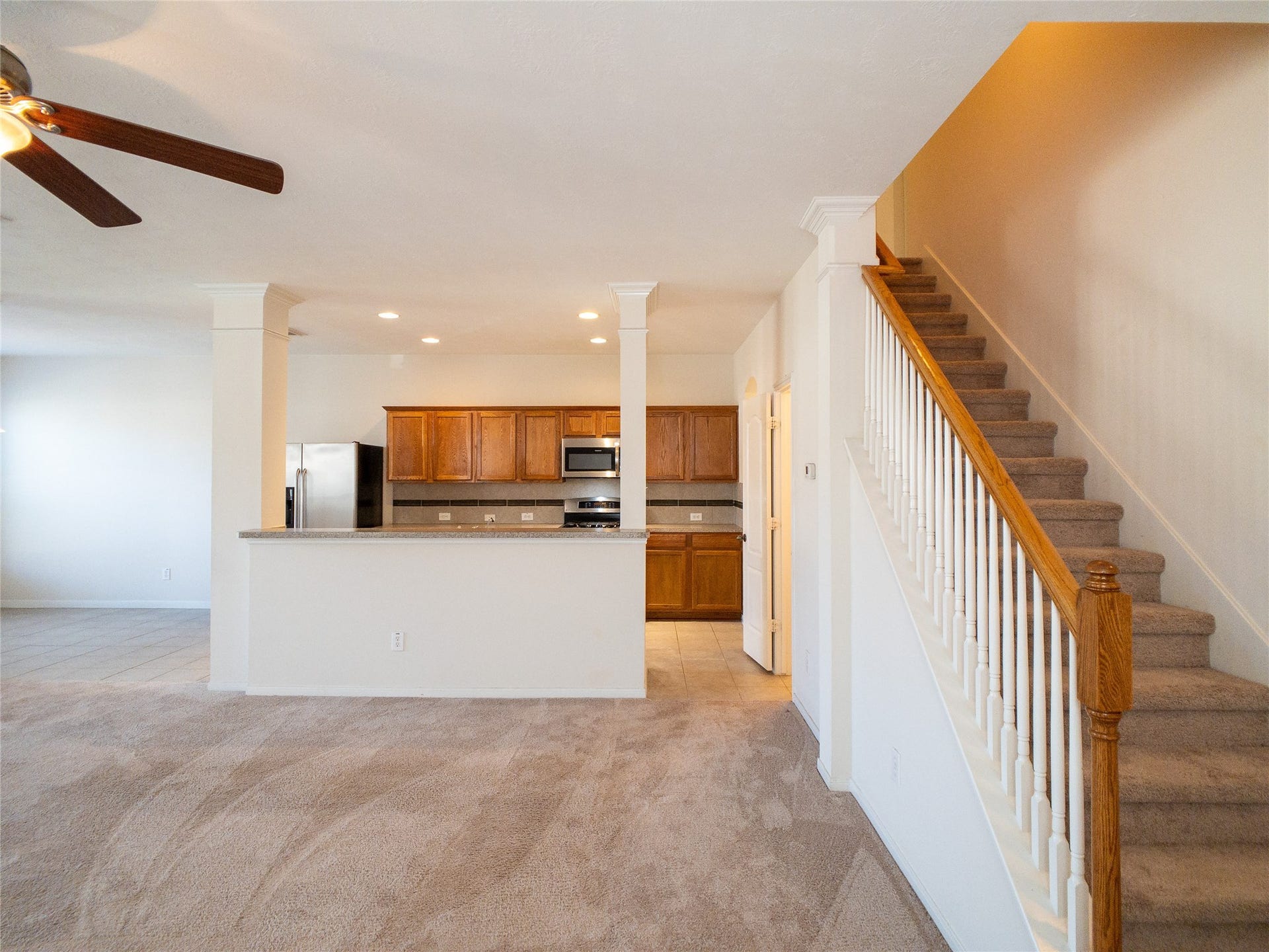 5406 Timber Court Hollow, Houston, TX 77084 carpet & tile flooring, elegant columns with crown molding