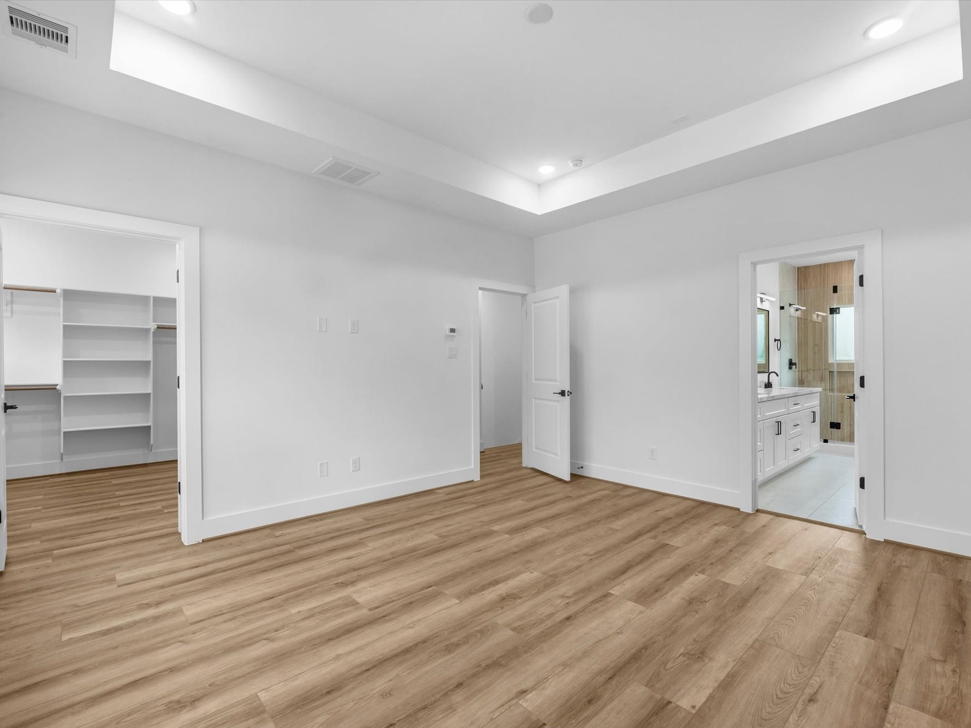 4804 Elysian St, #A/B, Houston, TX 77009 Private and spacious primary bedroom featuring beautiful tray ceilings and a peaceful third-floor location. Set apart from the main living spaces, the third-floor primary suite offers added privacy and a comfortable retreat.