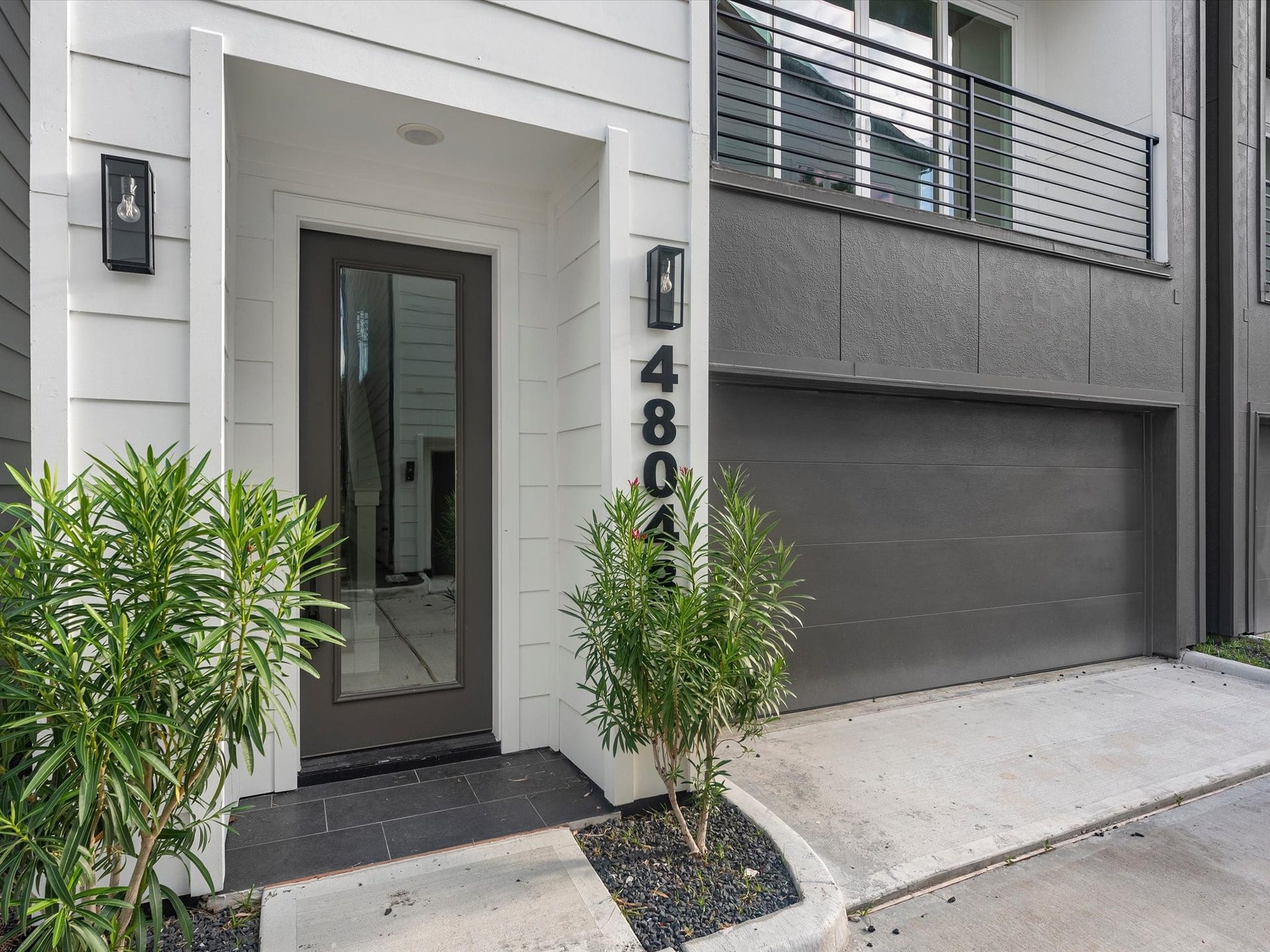 4804 Elysian St, #A/B, Houston, TX 77009 Beautiful exterior of this 3-bedroom, 3.5-bath home featuring a private balcony and a gated community setting. Located inside the Loop with easy access to major highways, dining, shopping, and everything Houston has to offer.