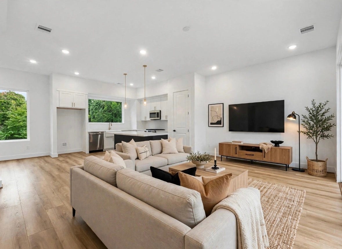 4804 Elysian St, #A/B, Houston, TX 77009 Spacious living area with an open-concept layout connecting seamlessly to the kitchen and dining space. Sliding glass doors open to the balcony, bringing in plenty of natural light, while a convenient half bath is located just across the hall.