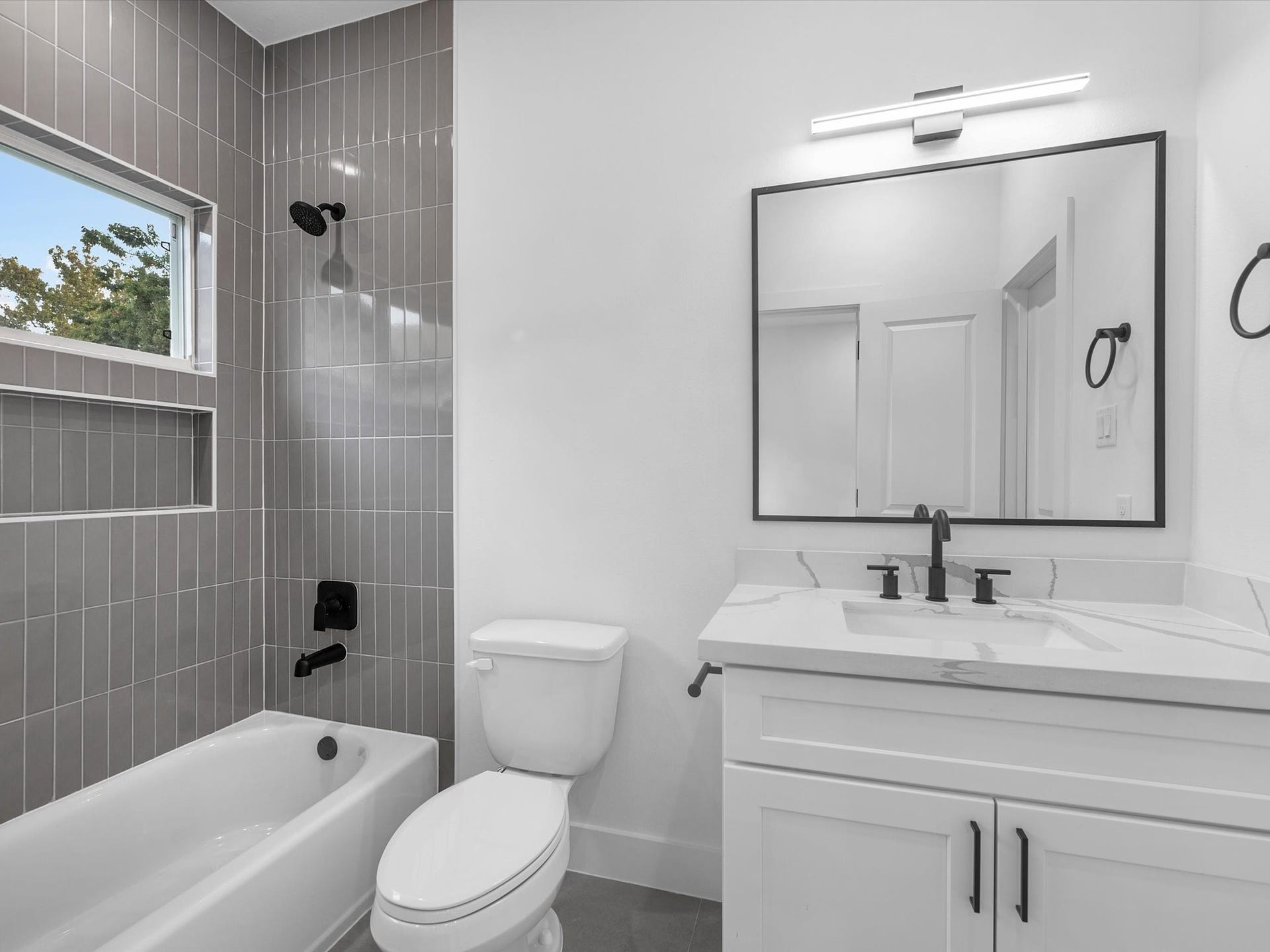 4804 Elysian St, #A/B, Houston, TX 77009 Beautiful full bathroom connected to the second third-floor bedroom, offering privacy and convenience. Every bedroom in the home features its own private full bathroom, creating a comfortable and functional layout for everyone.