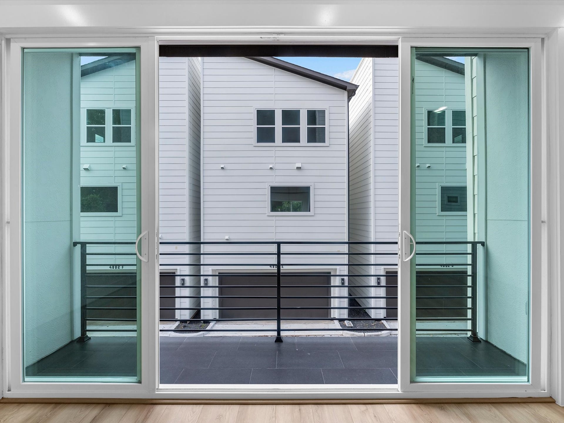 4804 Elysian St, #A/B, Houston, TX 77009 Large sliding glass doors create a seamless indoor-outdoor feel, opening directly to the private balcony. Perfect for bringing in natural light and extending the living space outdoors.