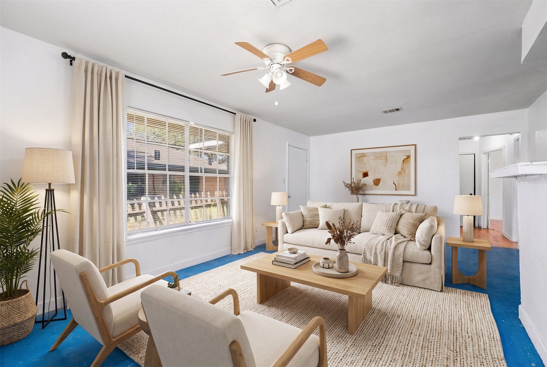 3218 5th Street, Stafford, TX 77477 The living room boasts a ceiling fan, tile flooring and a large window that brightens the space. *Virtually Staged