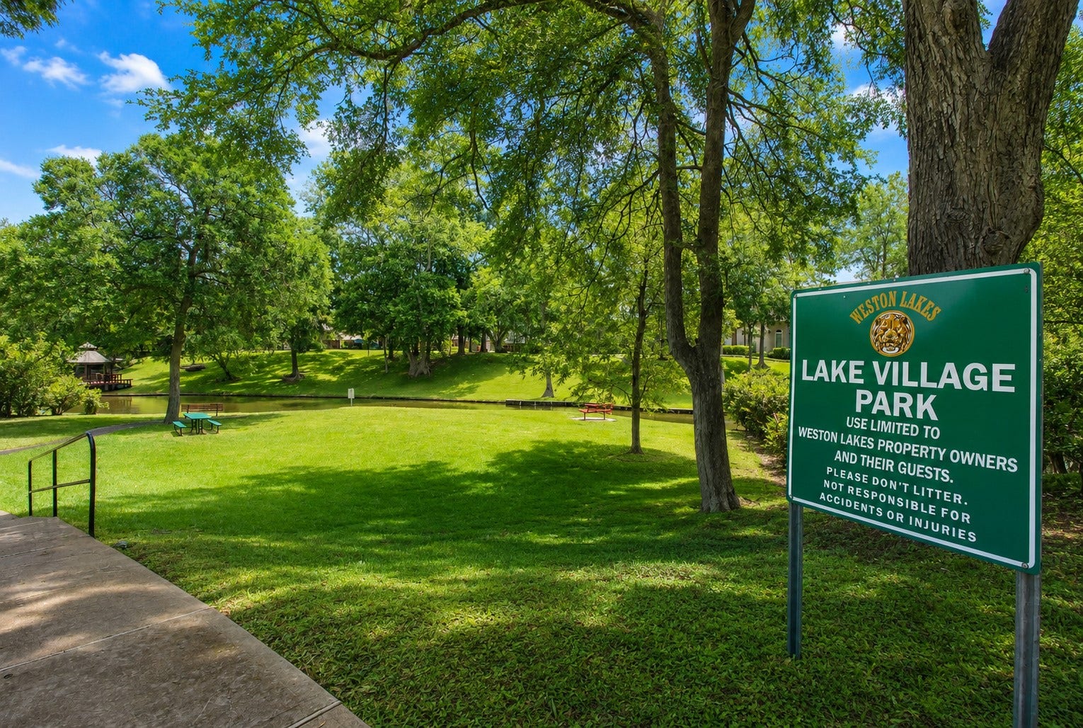 4631 Lake Village Drive, Fulshear, TX 77441 Lake Village Park is a private neighborhood park reserved exclusively for Weston Lakes residents and their guests. Nestled beneath a canopy of majestic oak trees, this scenic waterfront retreat offers lush green space, tranquil canal views, picnic areas, and peaceful walking pathscreating the perfect setting for morning strolls, family gatherings, or quiet afternoons surrounded by nature.