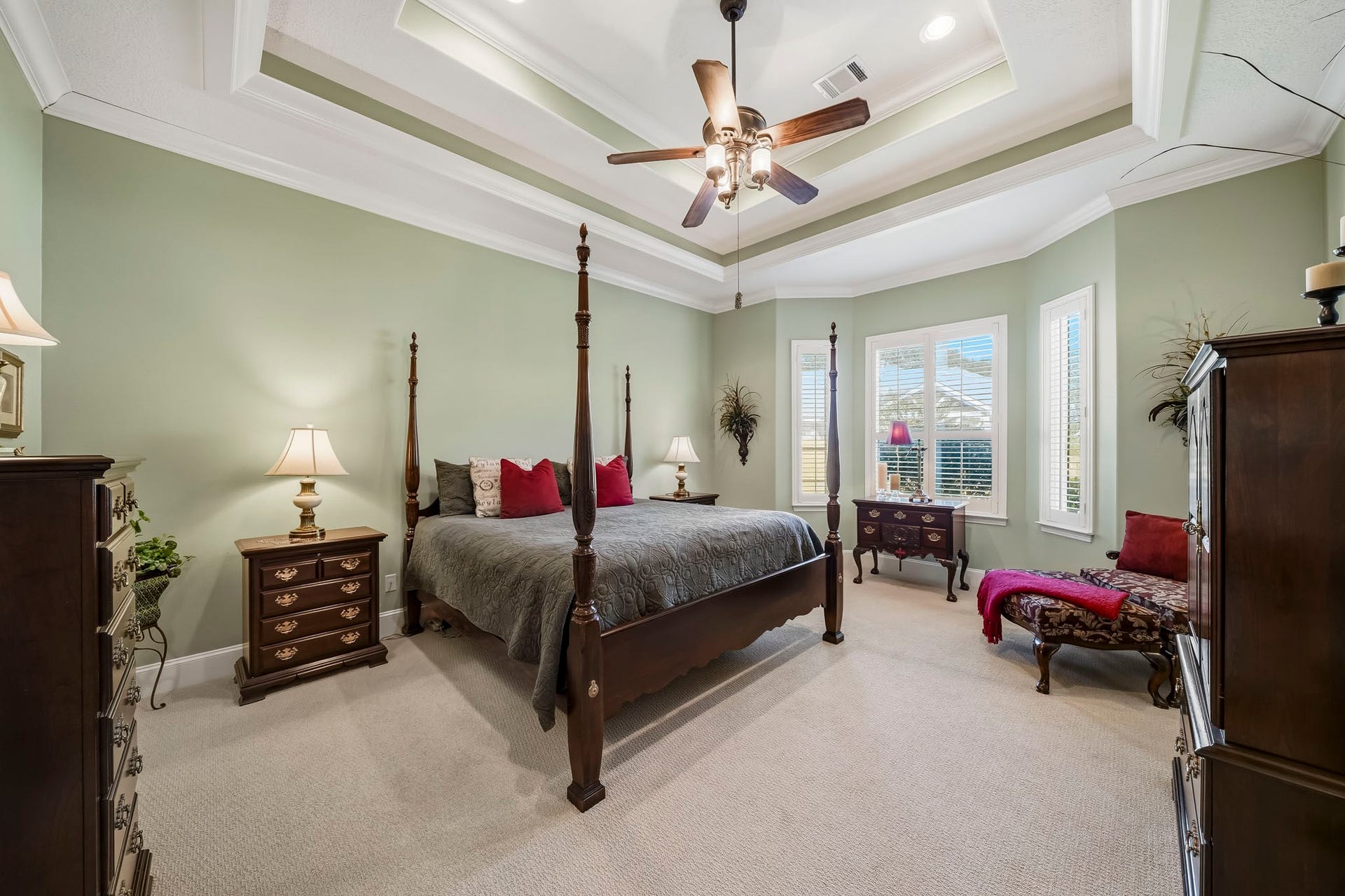 4631 Lake Village Drive, Fulshear, TX 77441 Rest and recharge in the comfort of this spacious Primary Bedroom, a serene retreat designed for both relaxation and everyday living. Natural light pours through a trio of windows adorned with plantation shutters, creating a bright yet tranquil atmosphere. Generous proportions easily accommodate a king-sized bed, dual nightstands, and a dresser, while still leaving ample room for a cozy sitting area, reading nook, or dedicated workspace.