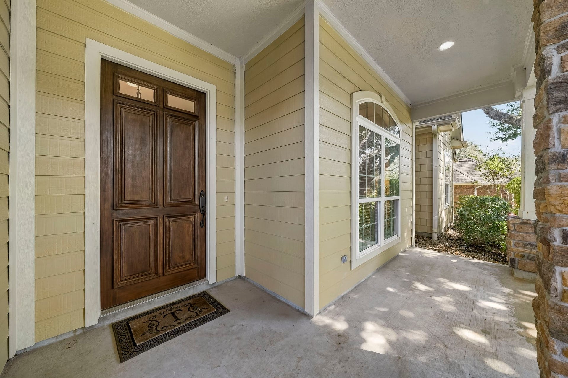 4631 Lake Village Drive, Fulshear, TX 77441 The spacious covered Front Porch offers a warm welcome and the perfect place to unwind. Picture yourself settling into a rocking chair with a glass of sweet tea in hand, enjoying the gentle breeze as the day slowly drifts by.