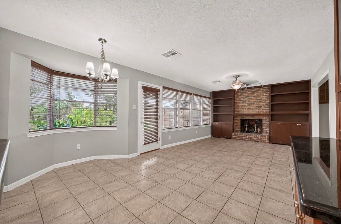 11730 Dorrance Lane, Meadows Place, TX 77477 2nd family area with fireplace
