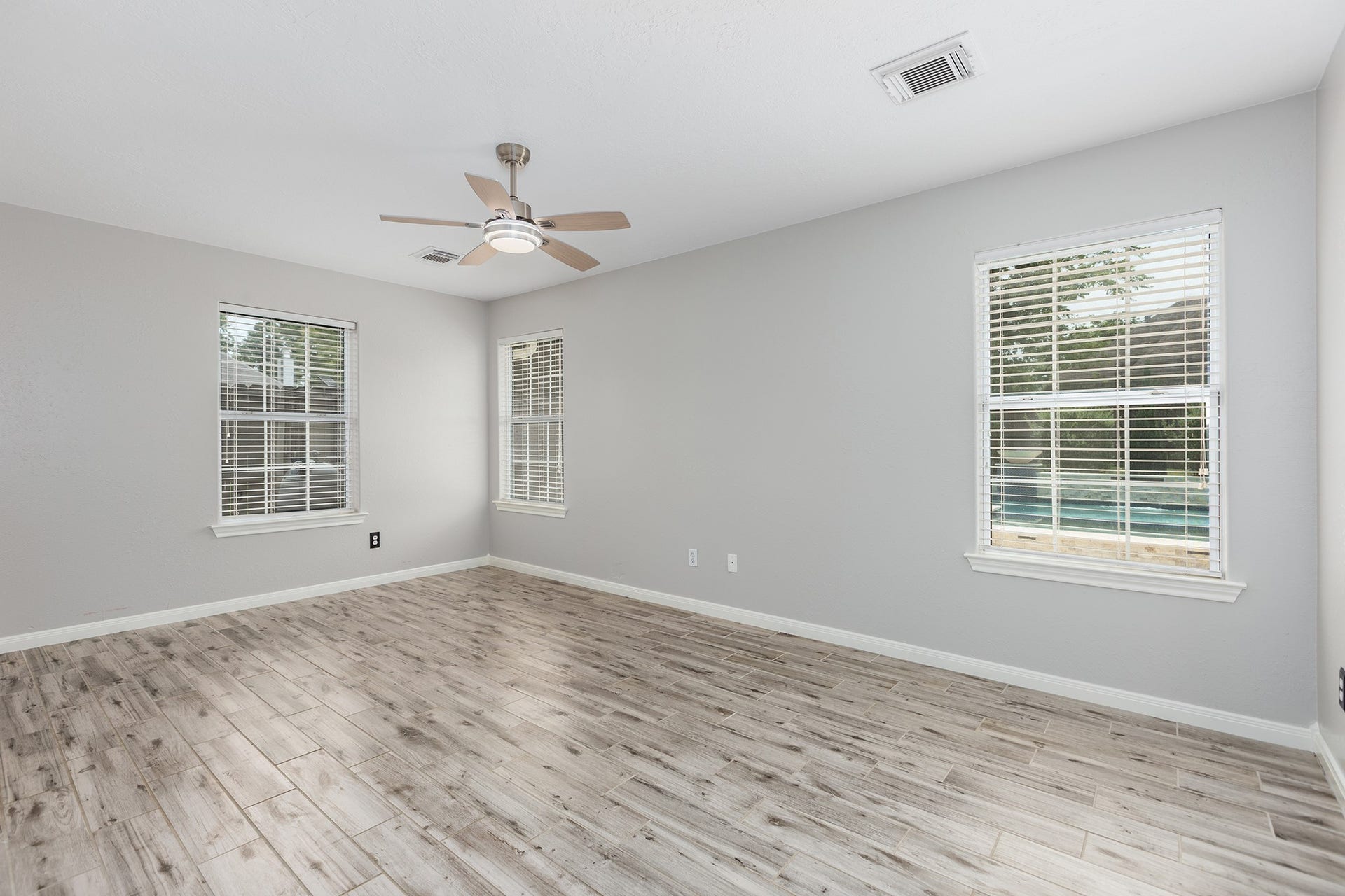 12830 Point Aquarius Boulevard, Willis, TX 77318 Primary bedroom in the home with HUGE walk-in closet and ensuite bathroom.