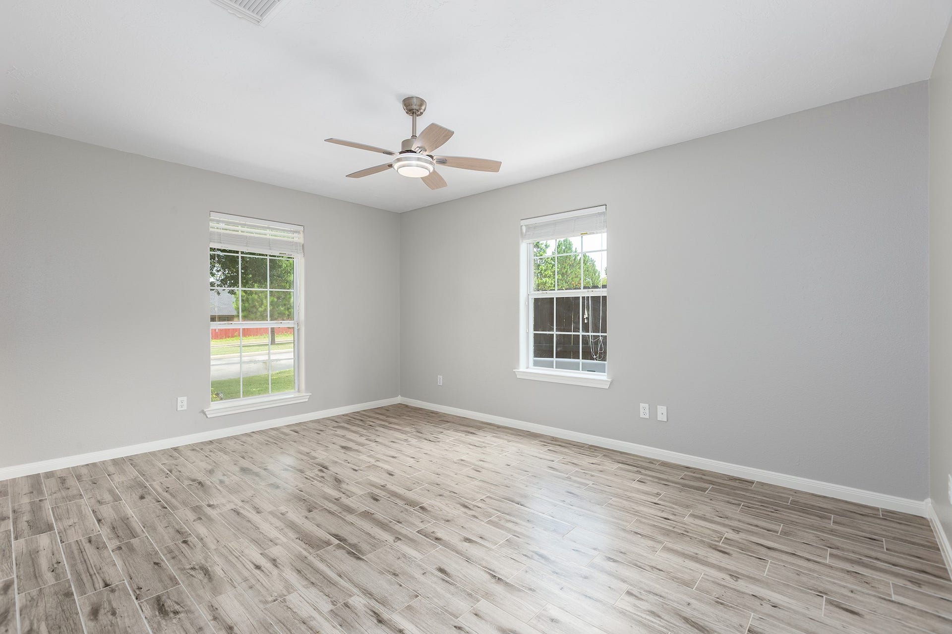 12830 Point Aquarius Boulevard, Willis, TX 77318 One of the secondary bedrooms with nots of natural lighting.