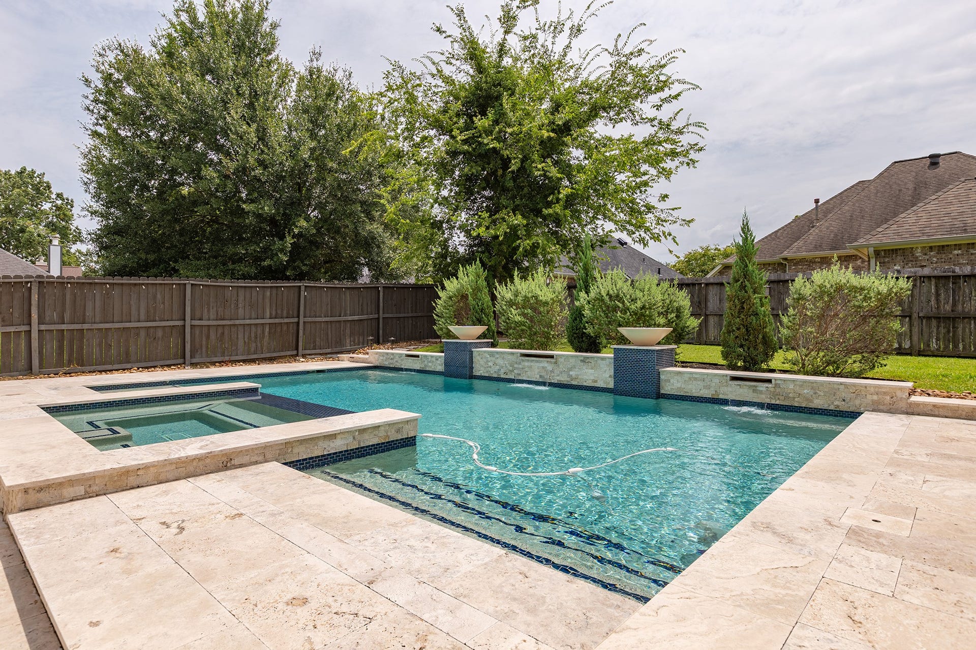 12830 Point Aquarius Boulevard, Willis, TX 77318 Home has new private pool, hot tub, and travertine decking. The pool maintenance and yard maintenance are INCLUDED in the monthly rent.