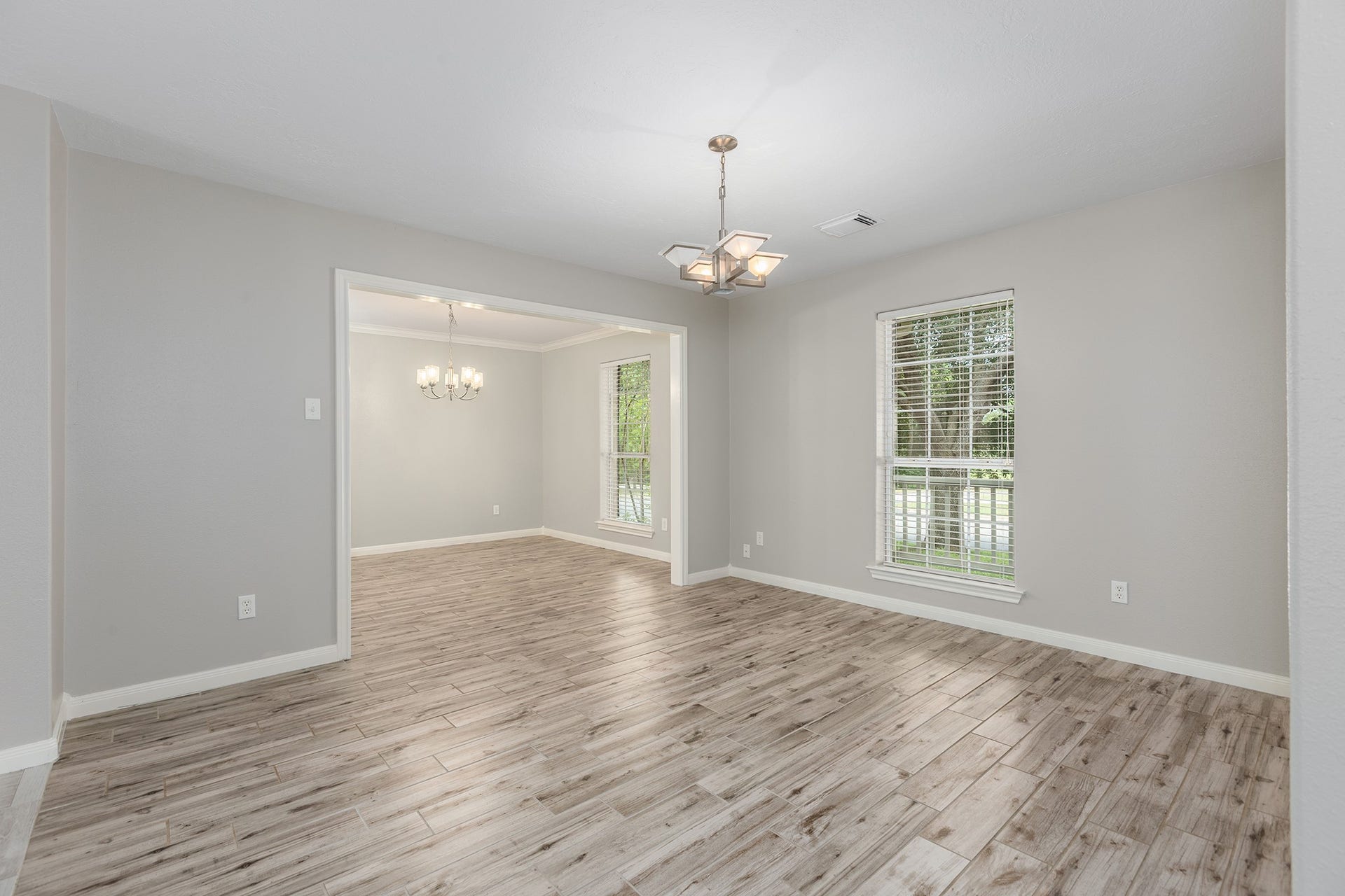 12830 Point Aquarius Boulevard, Willis, TX 77318 This is the formal dining room leading into kitchen, and open to the living room for easy entertaining.
