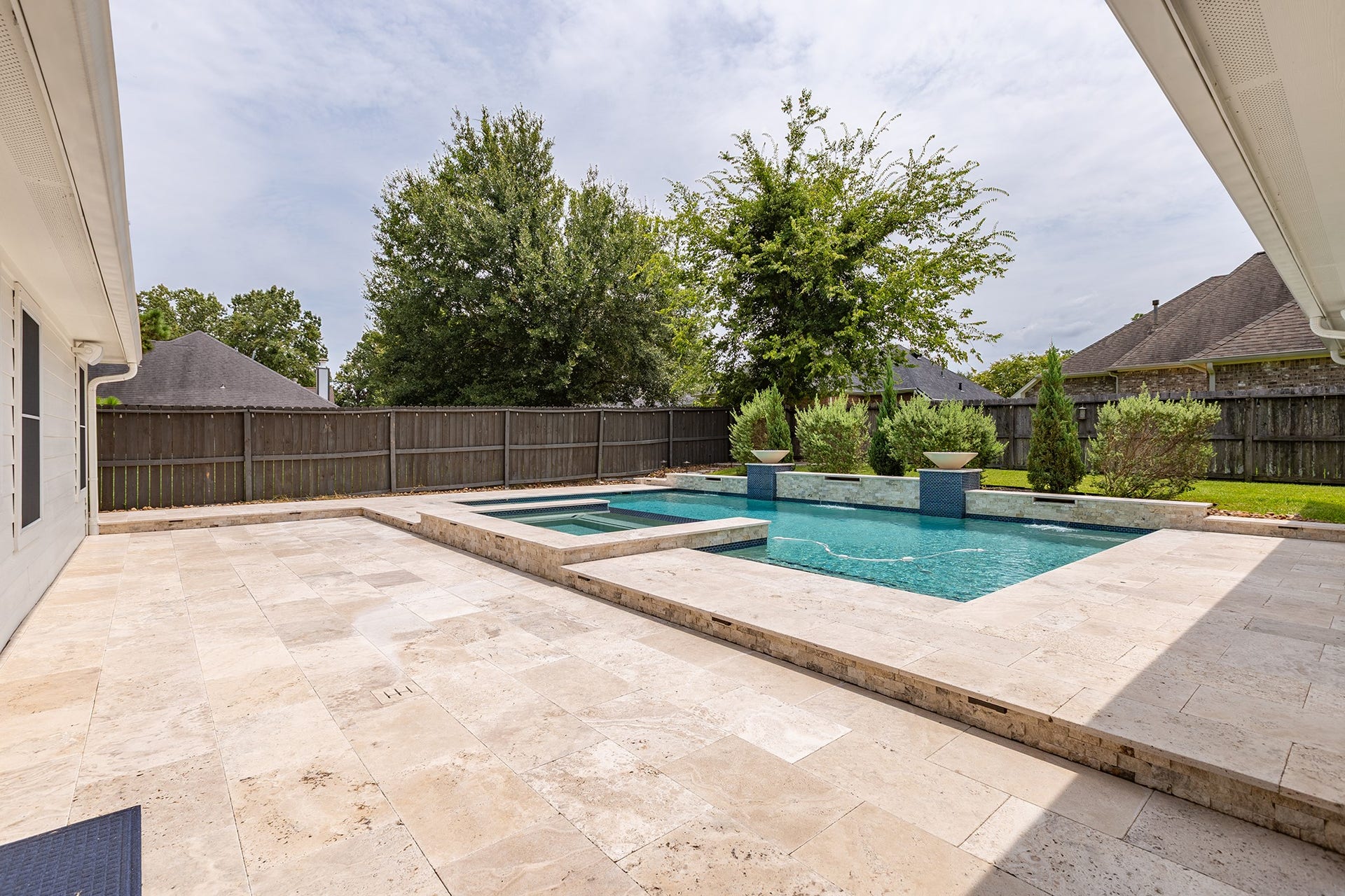 12830 Point Aquarius Boulevard, Willis, TX 77318 Custom pool and hot tub, build just two years ago and will be maintained at no extra cost.