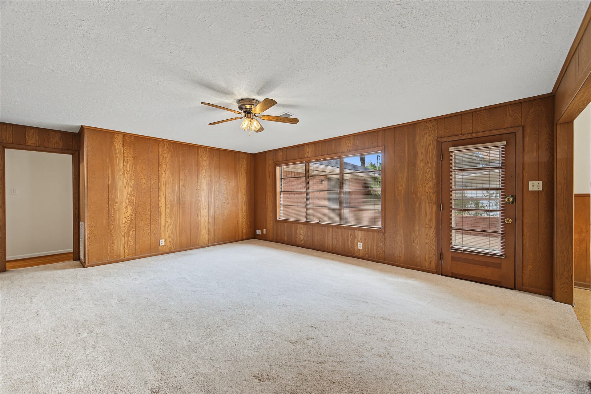 HERE'S ANOTHER VIEW OF THE FAMILY ROOM/ DEN. PLENTY OF WINDOWS THAT BRING IN NATURAL LIGHT