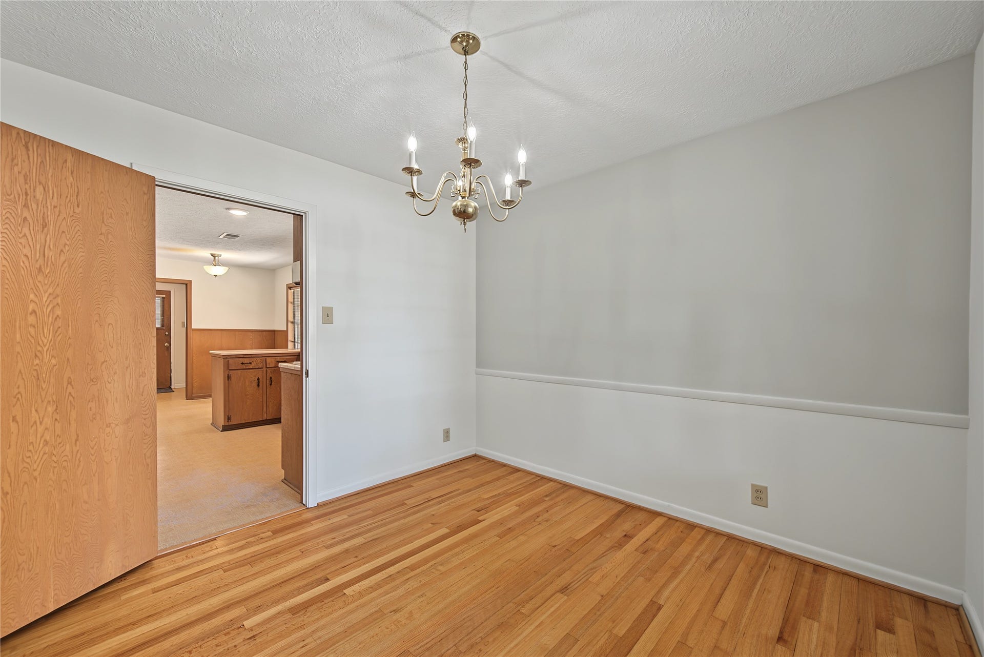 FORMAL DINING ROOM VIEW TO THE KITCHEN