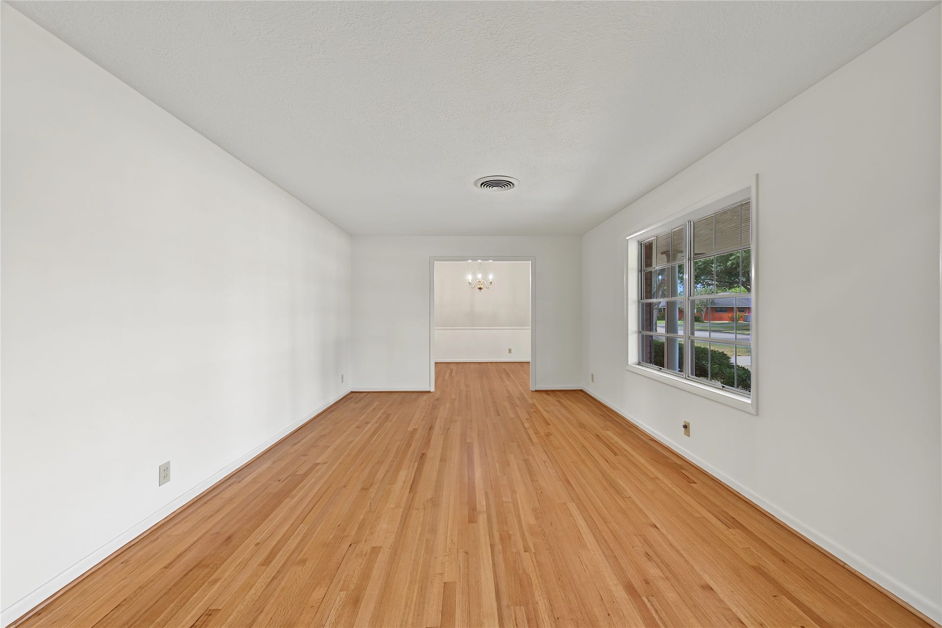 FORMAL LIVING ROOM WITH HARDWOOD FLOORS
