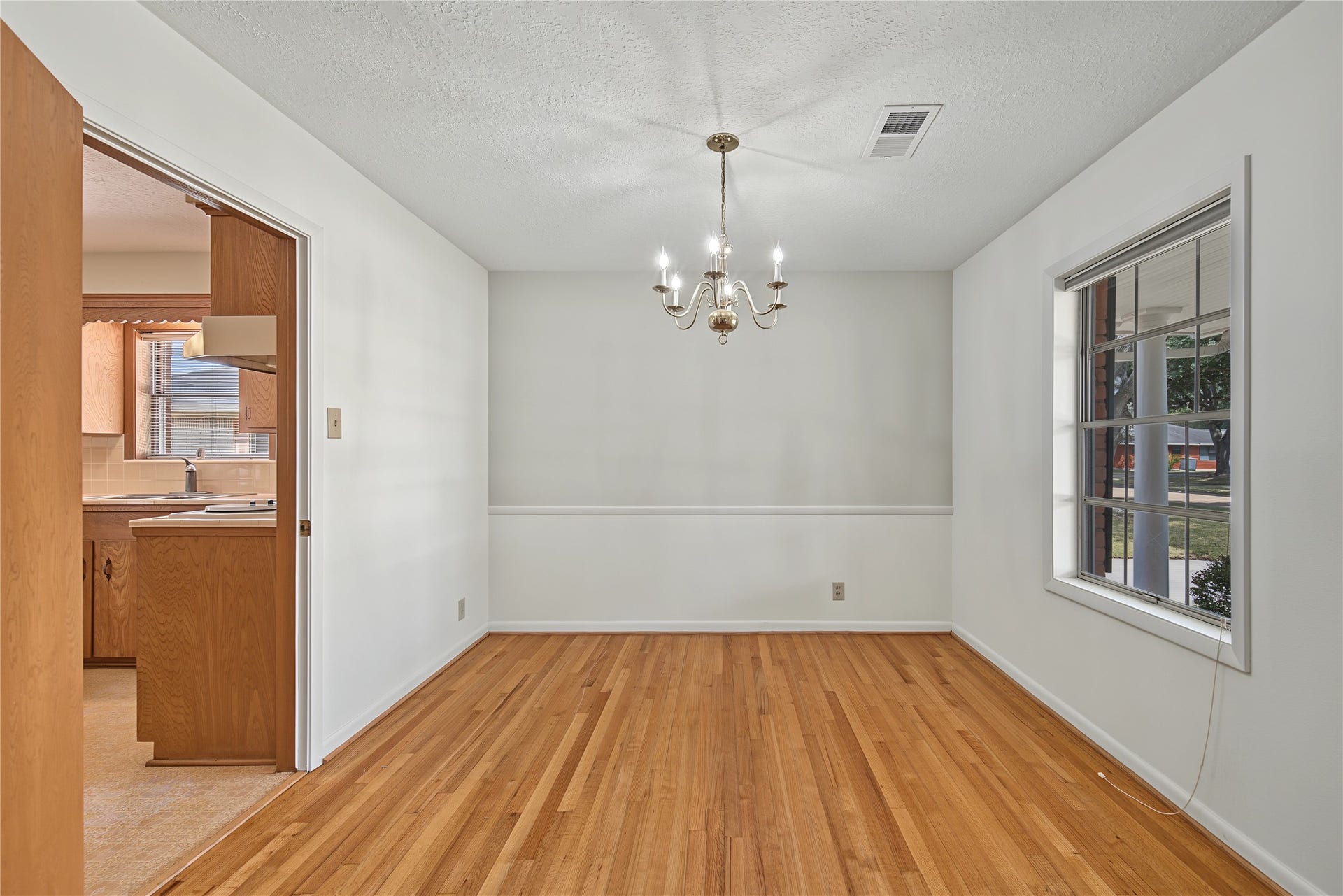 FORMAL DINING ROOM WITH HARDWOOD FLOORS