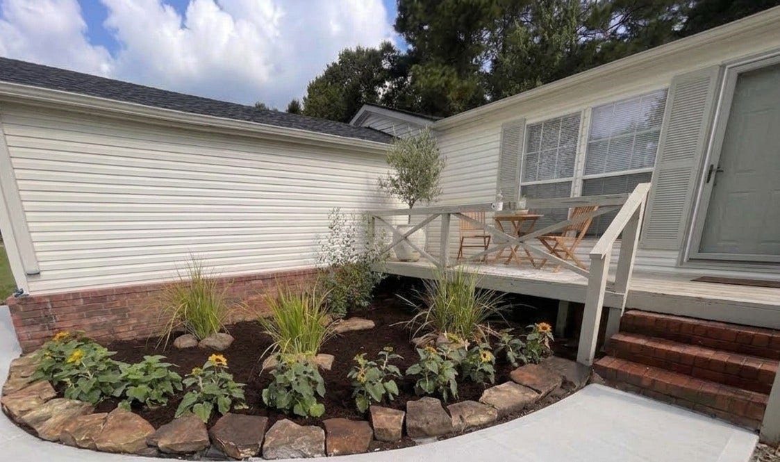 16544 Desert Star Drive, Conroe, TX 77302 Beautiful new garden and landscaping along with large front porch welcomes you and your guests inside. Virtually staged porch