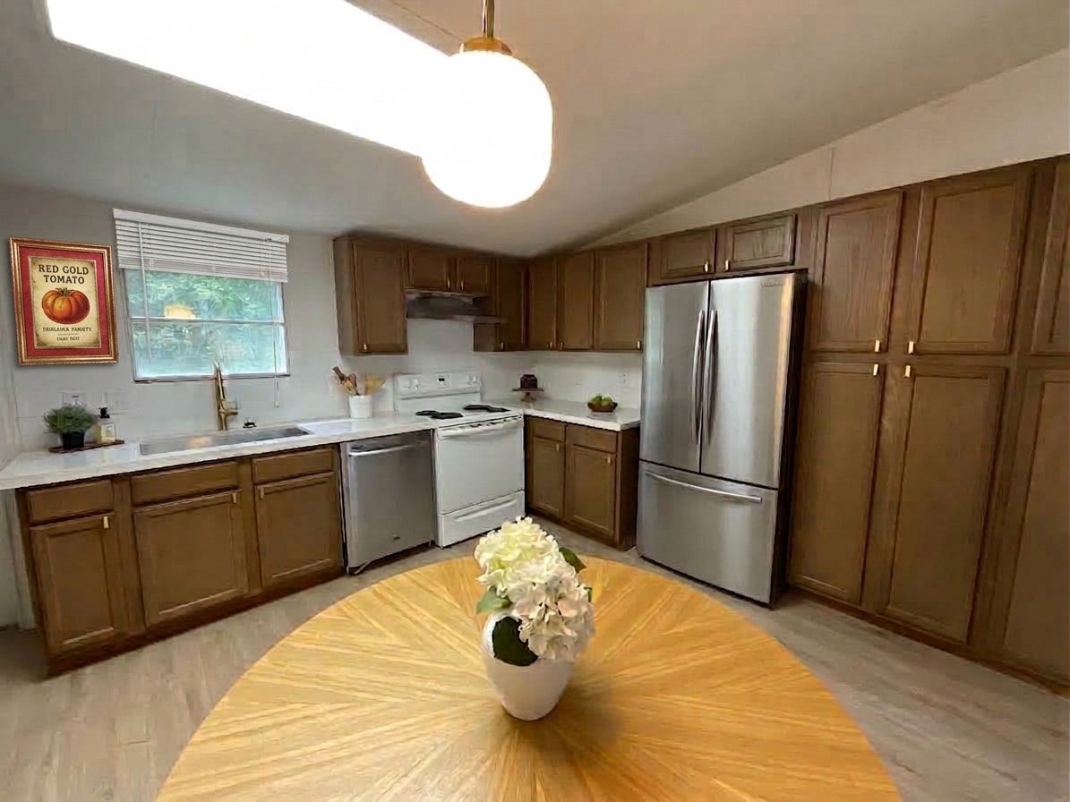 16544 Desert Star Drive, Conroe, TX 77302 Updated Kitchen with recent cabinets, new lighting, Quartz Counters, new backsplash and more! - Refrigerator is similar to the one staged in this picture