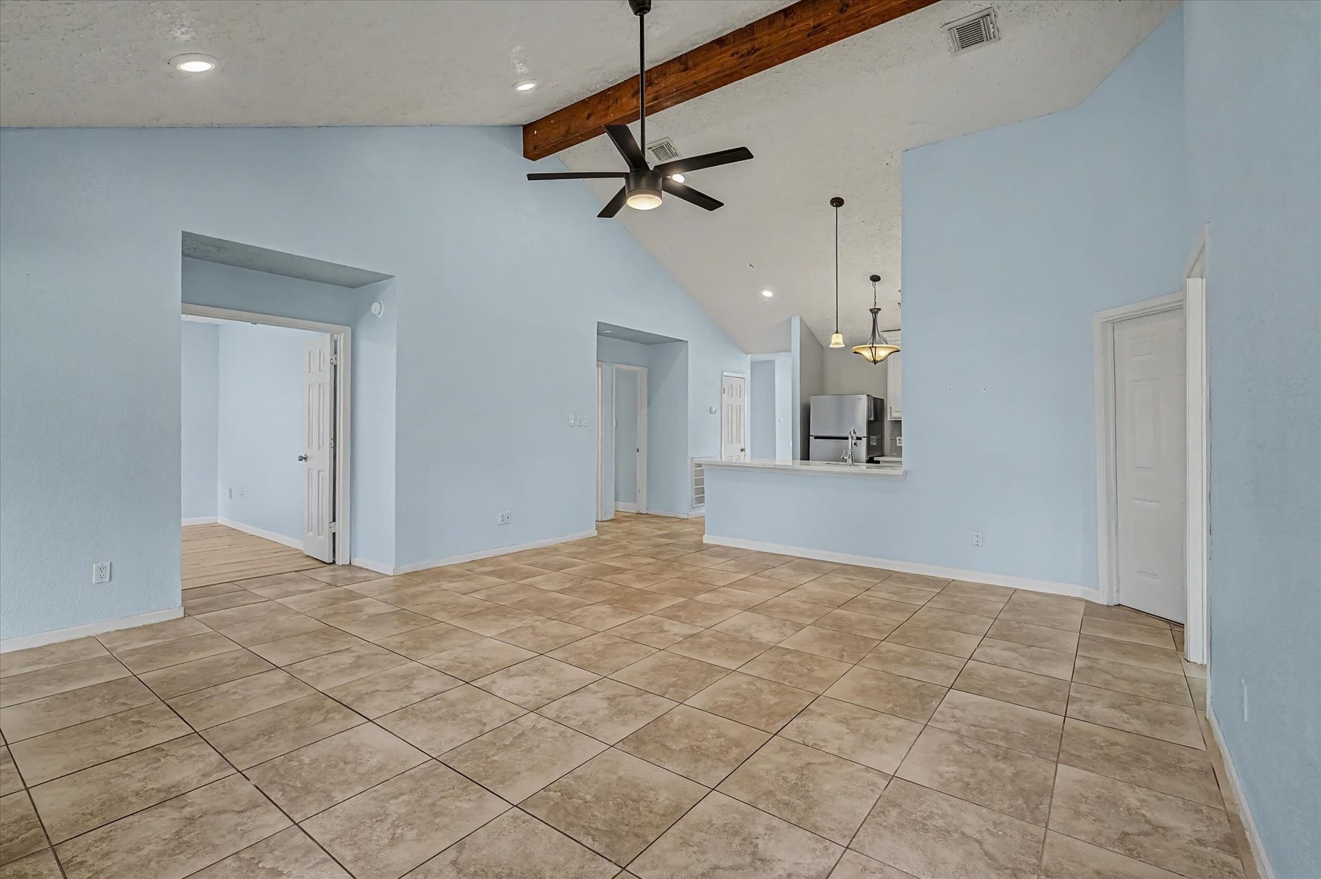 14218 Whitecross Drive, Houston, TX 77083 This spacious family area is filled with abundant natural light.