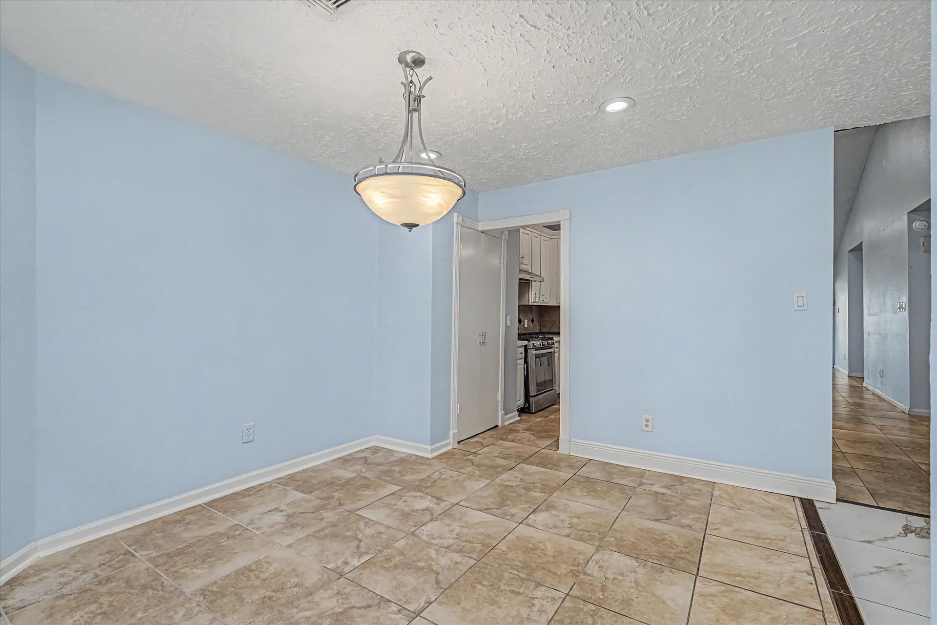 14218 Whitecross Drive, Houston, TX 77083 Formal dining entry to kitchen